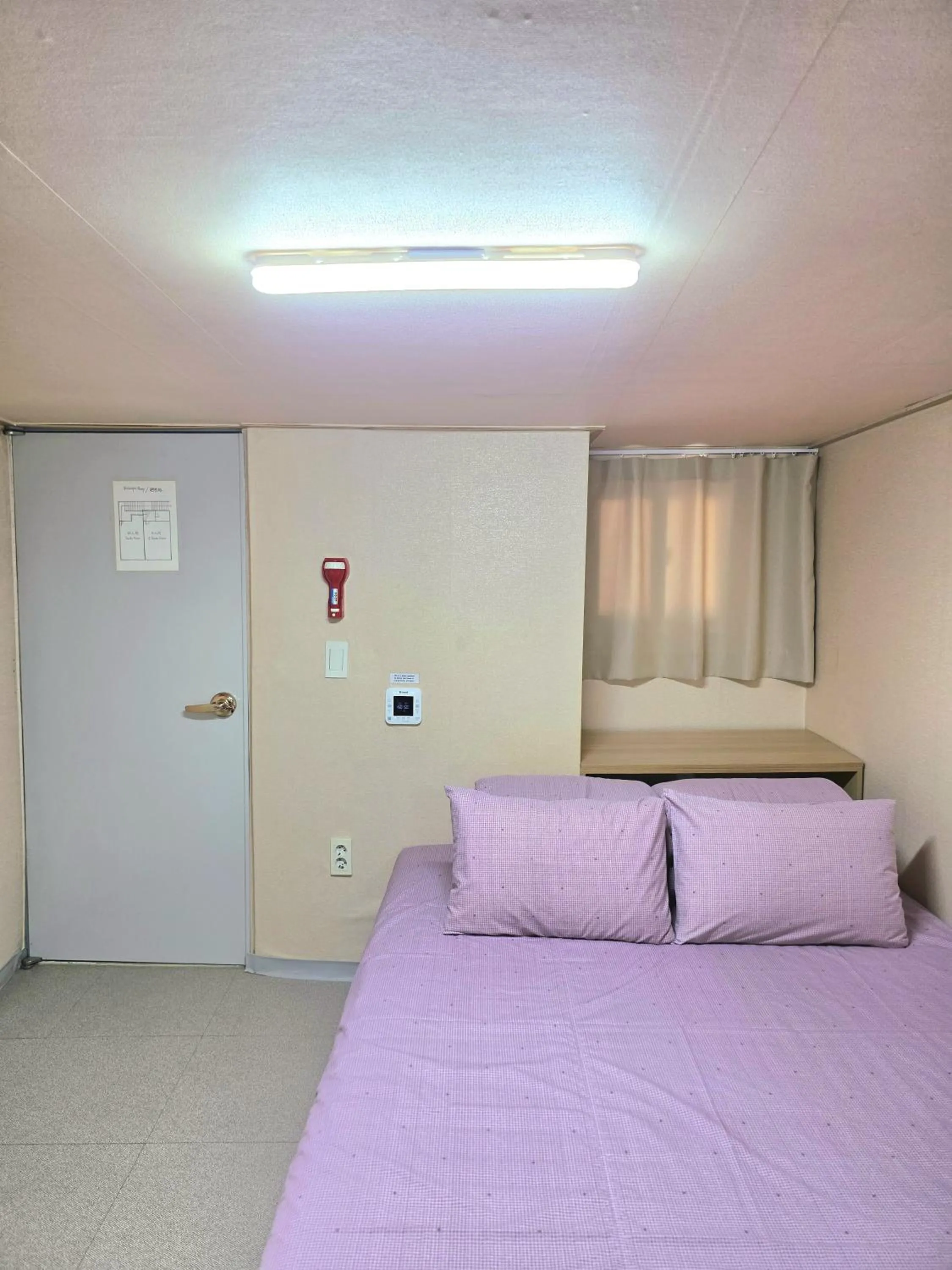 Bed in Happy Garden Guesthouse