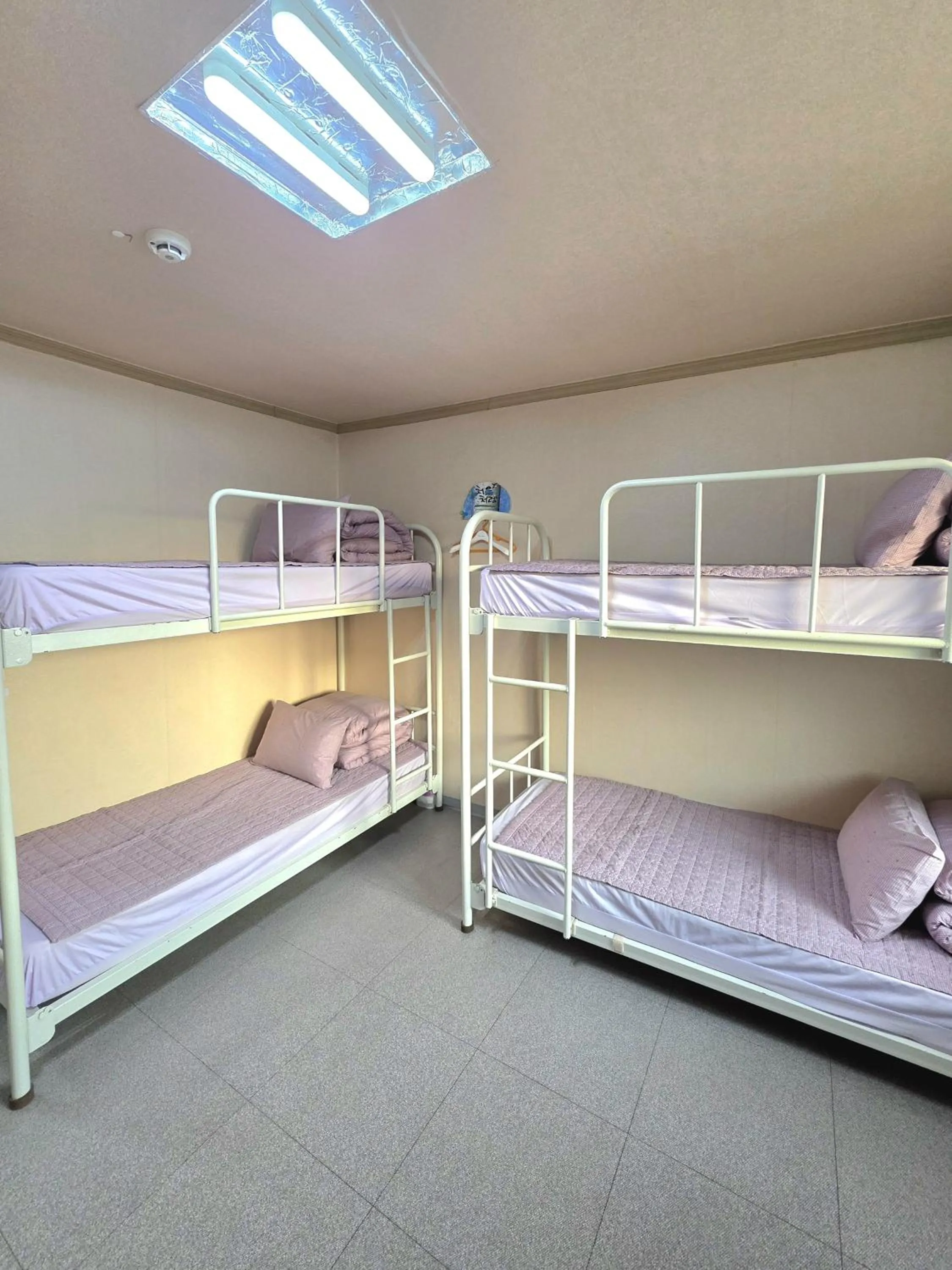 Bed in Happy Garden Guesthouse