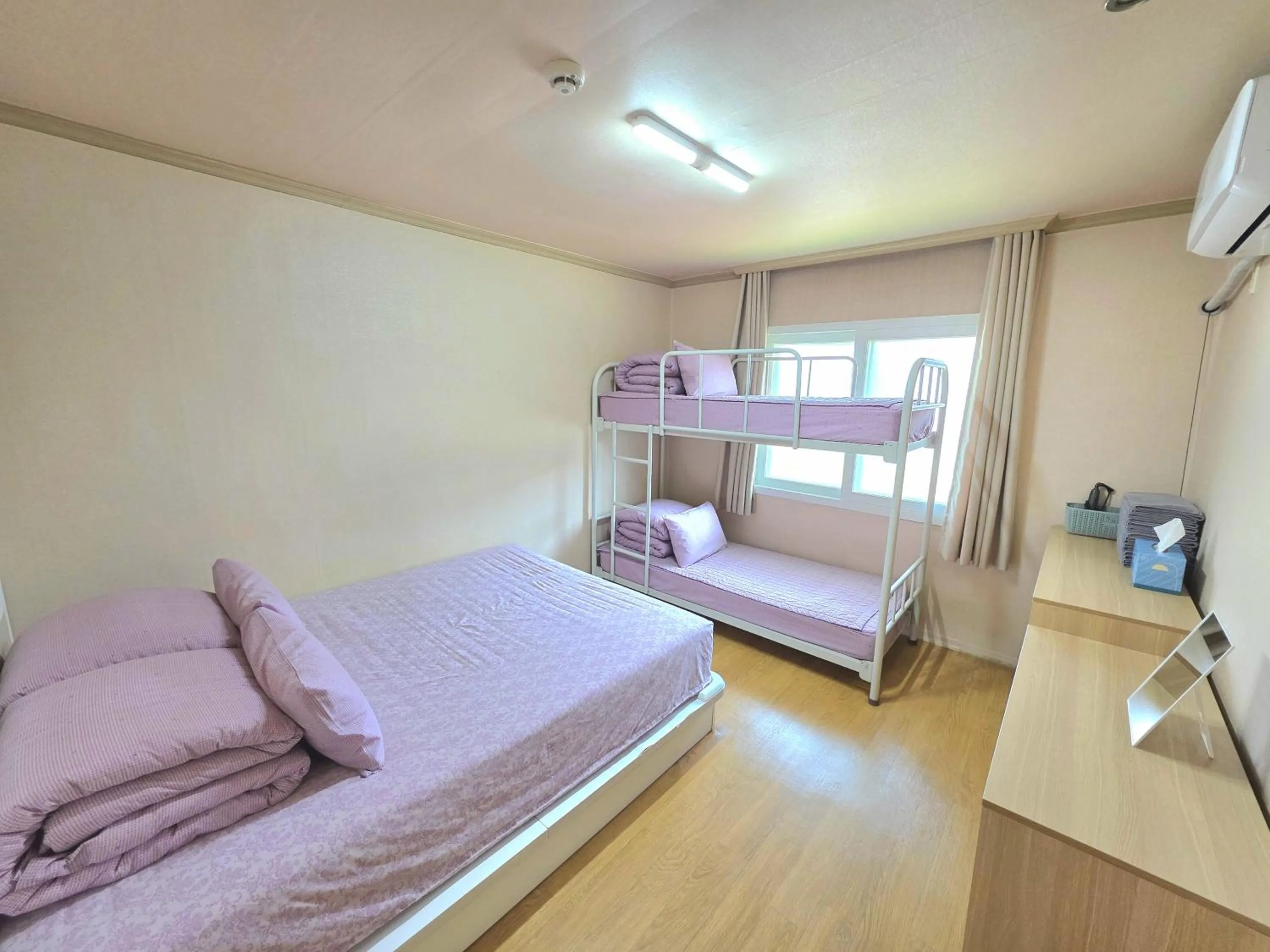 Bed in Happy Garden Guesthouse