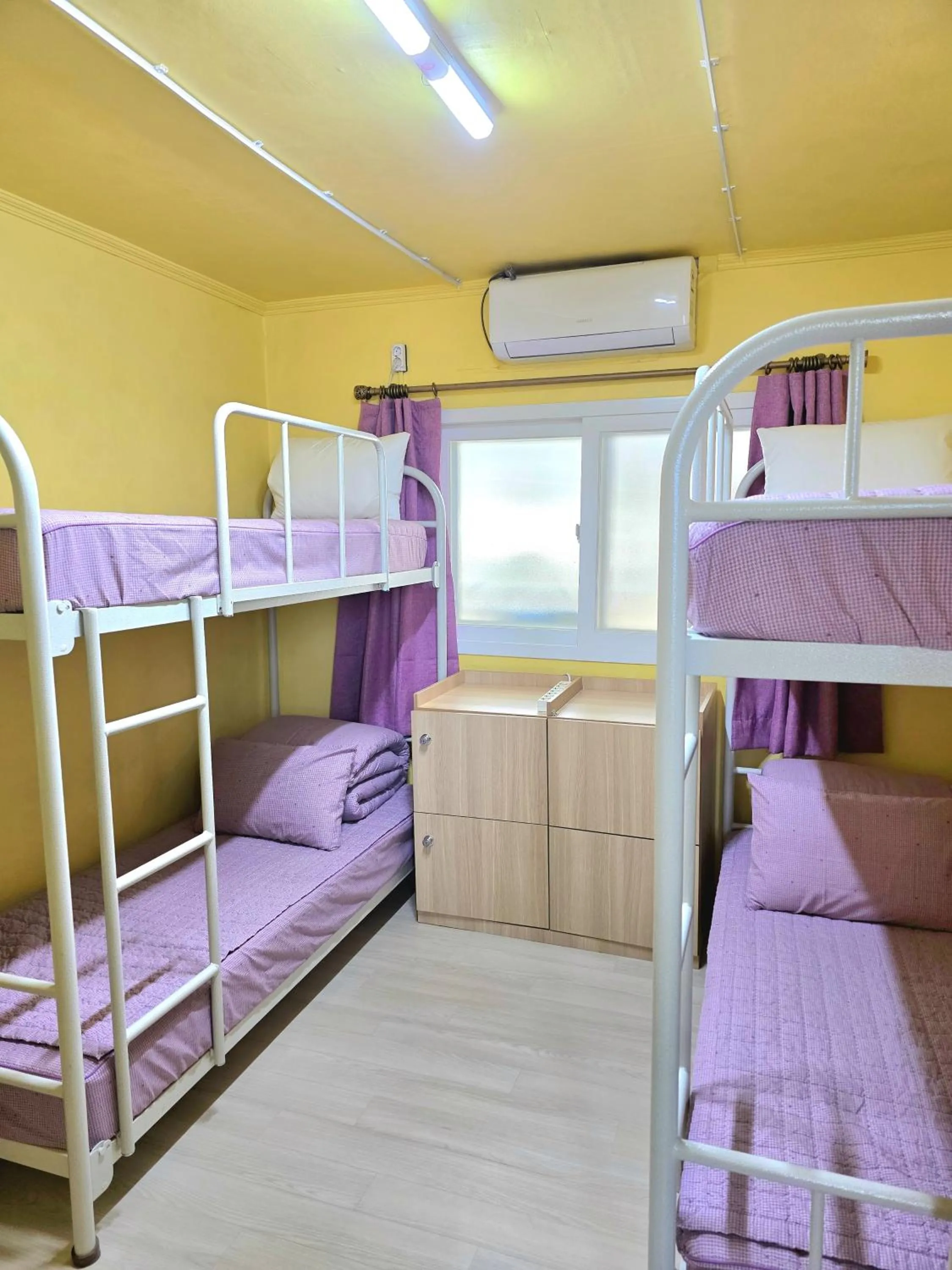 Bed in Happy Garden Guesthouse