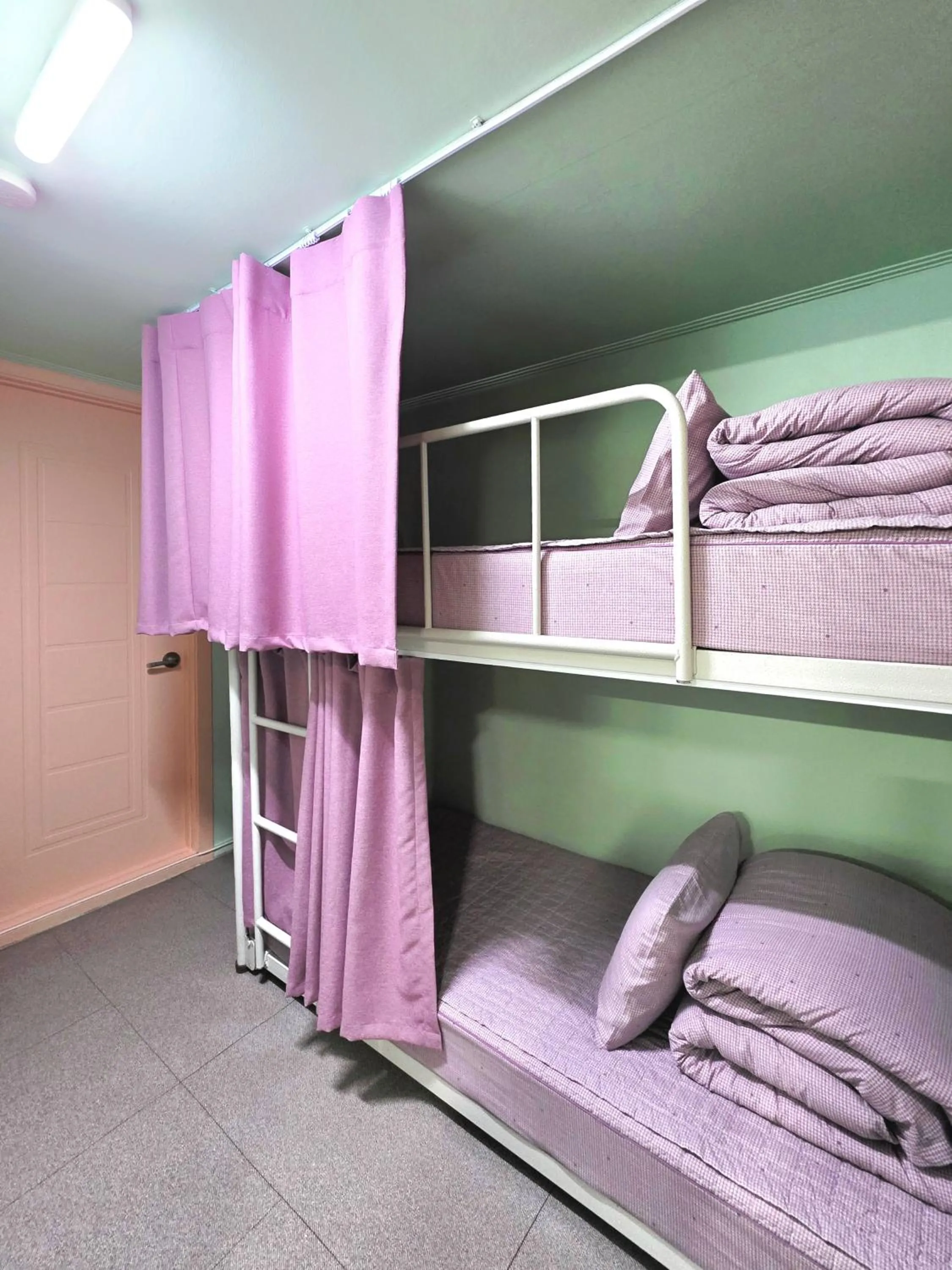 Bed in Happy Garden Guesthouse