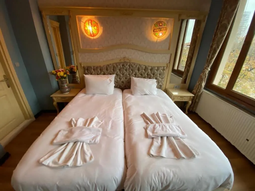 Bed in Optimist Hotel