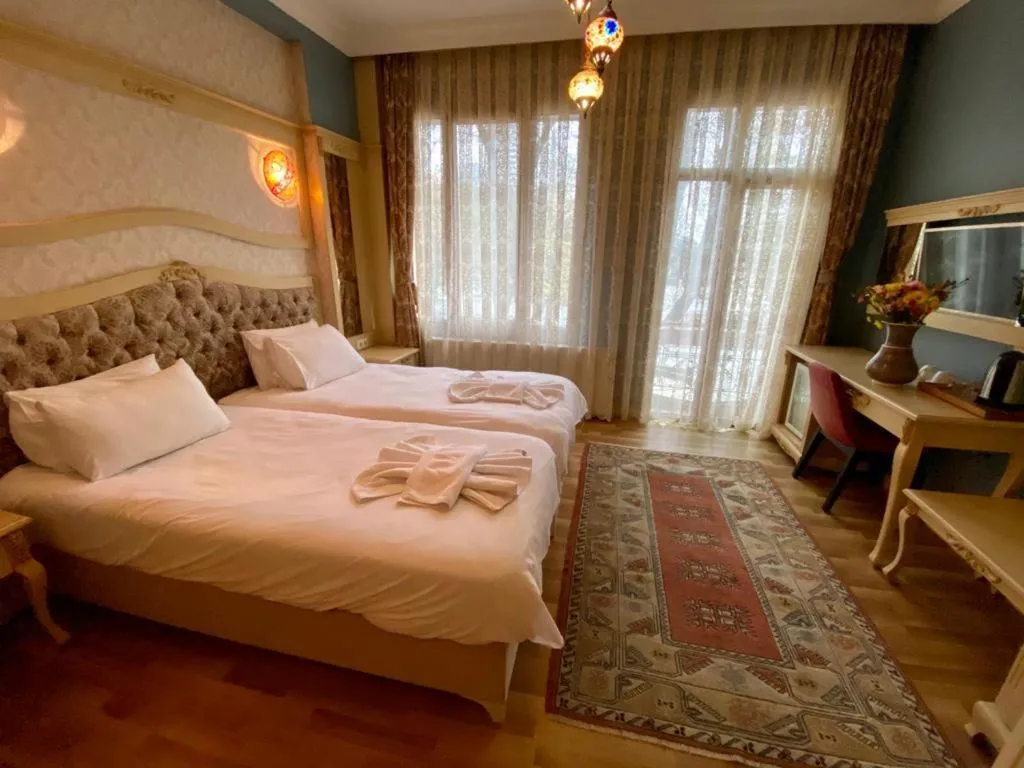 Bed in Optimist Hotel