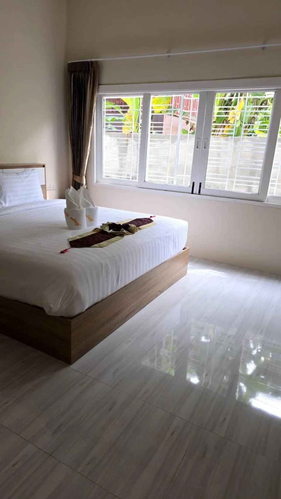 Bed in Natural Samui Hotel