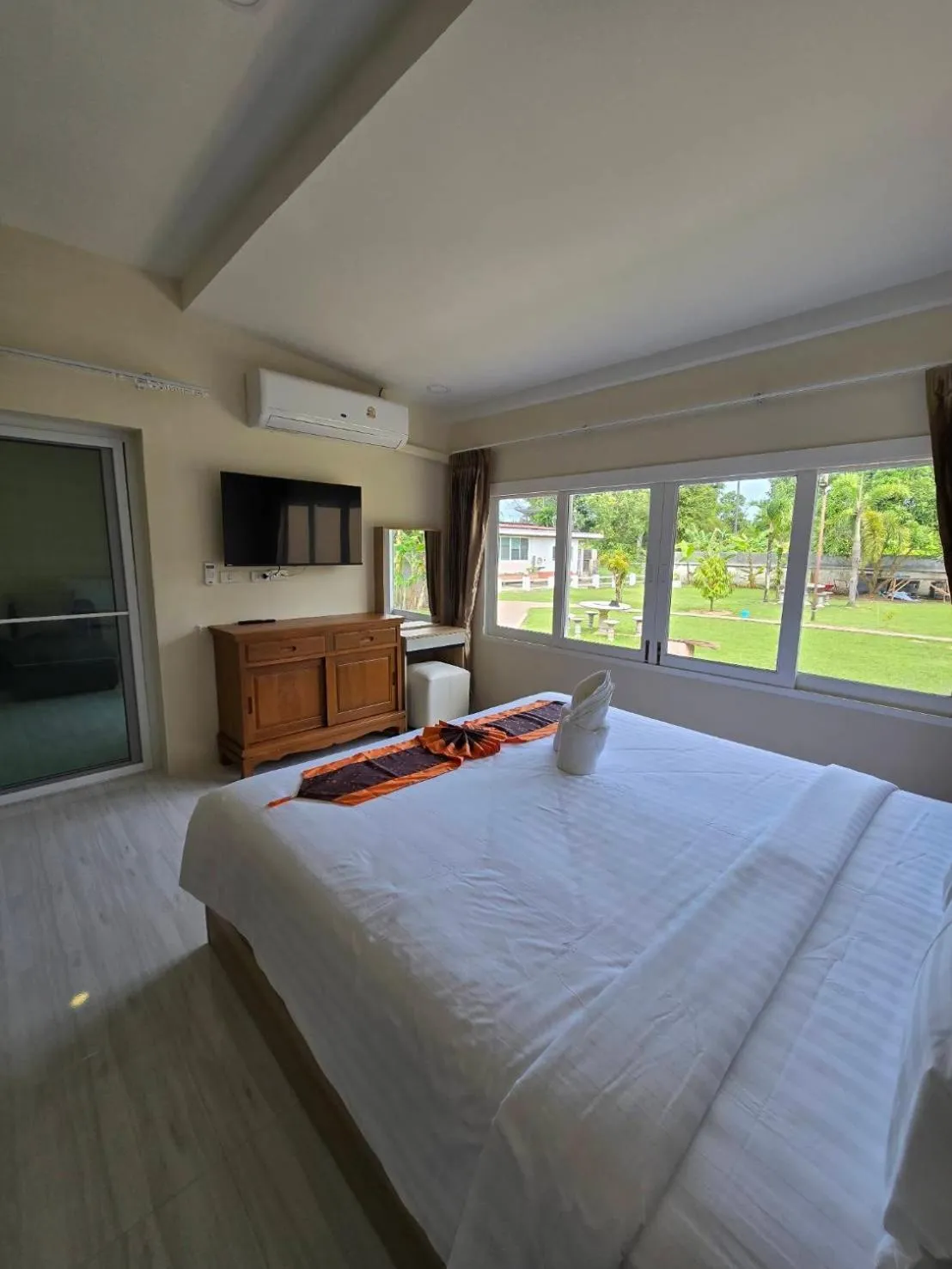 Bed in Natural Samui Hotel