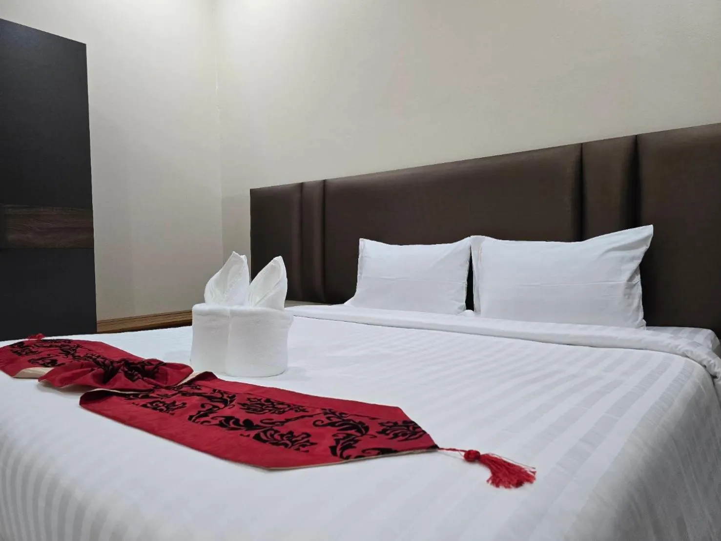 Bed in Natural Samui Hotel