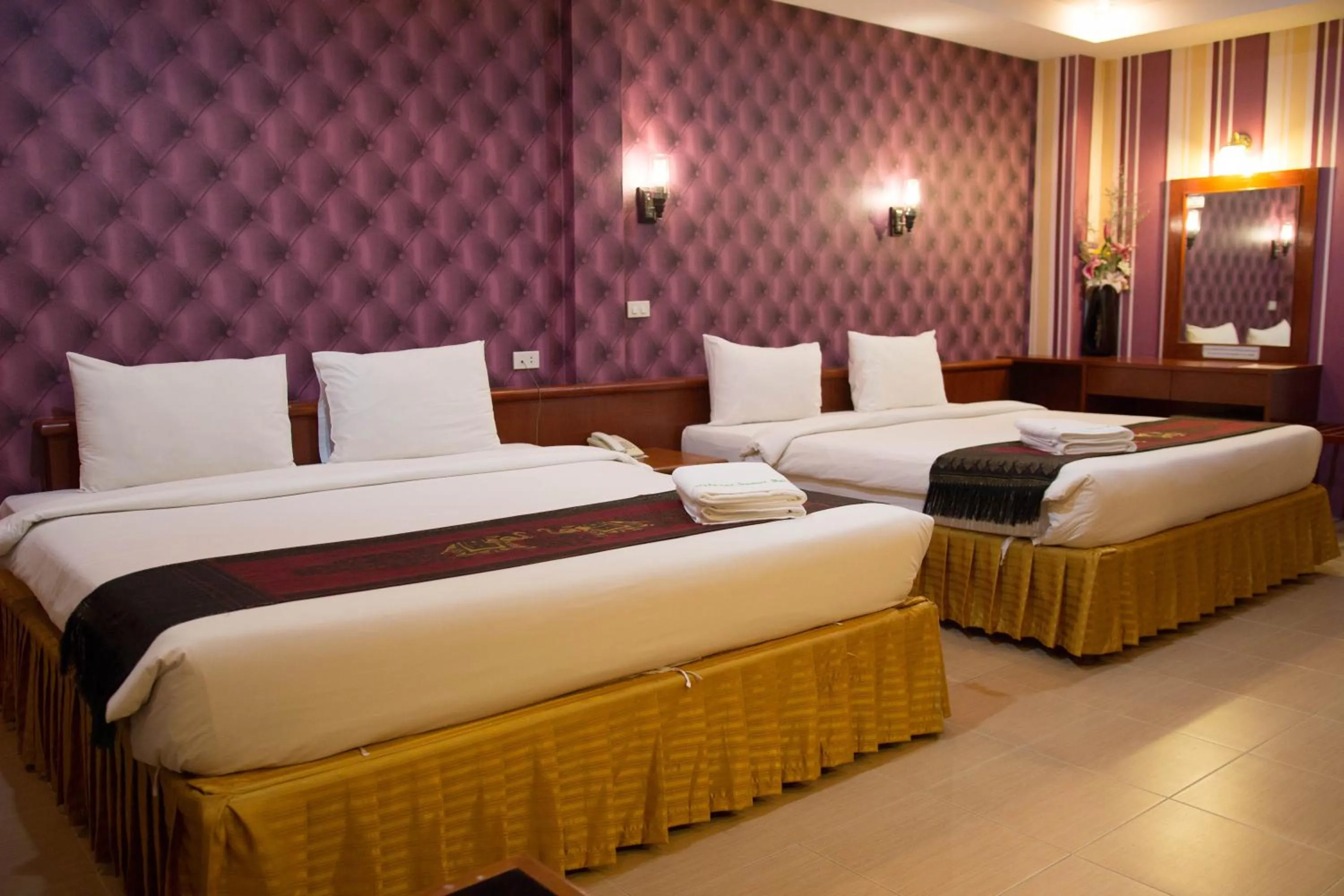 Bed in Natural Samui Hotel