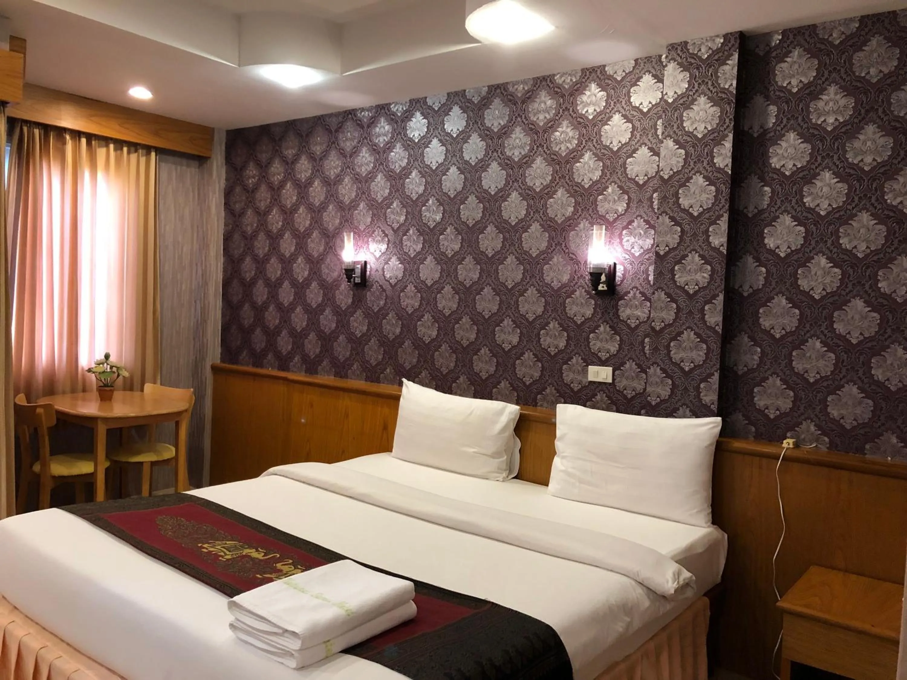 Bed in Natural Samui Hotel