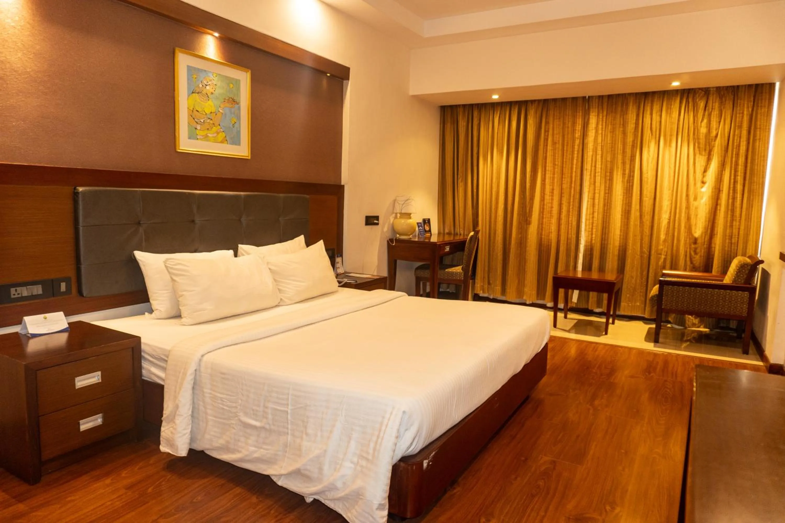 Photo of the whole room, Bed in Classic Sarovar Portico Trivandrum