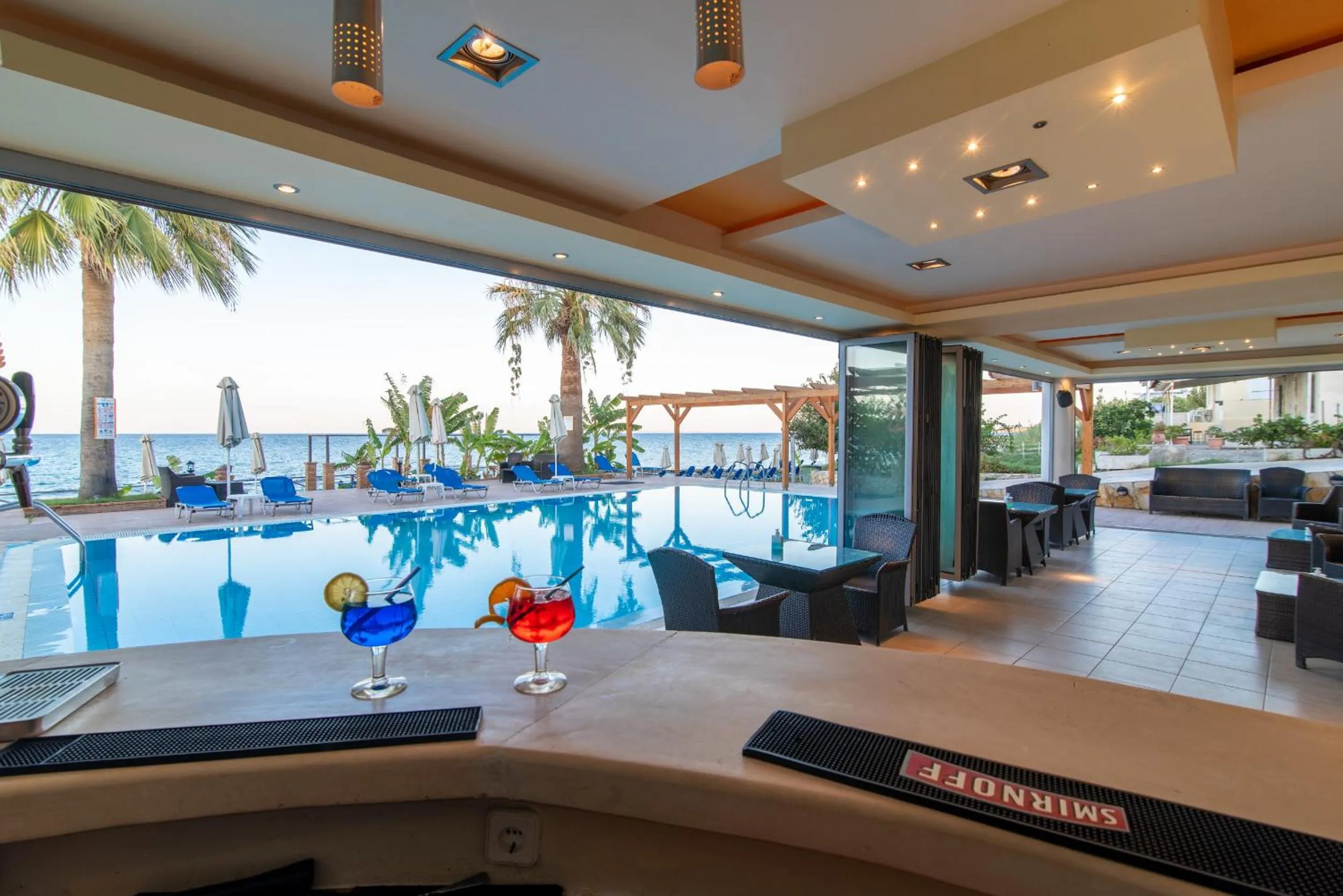 Lounge or bar in Belussi Beach Hotel & Suites