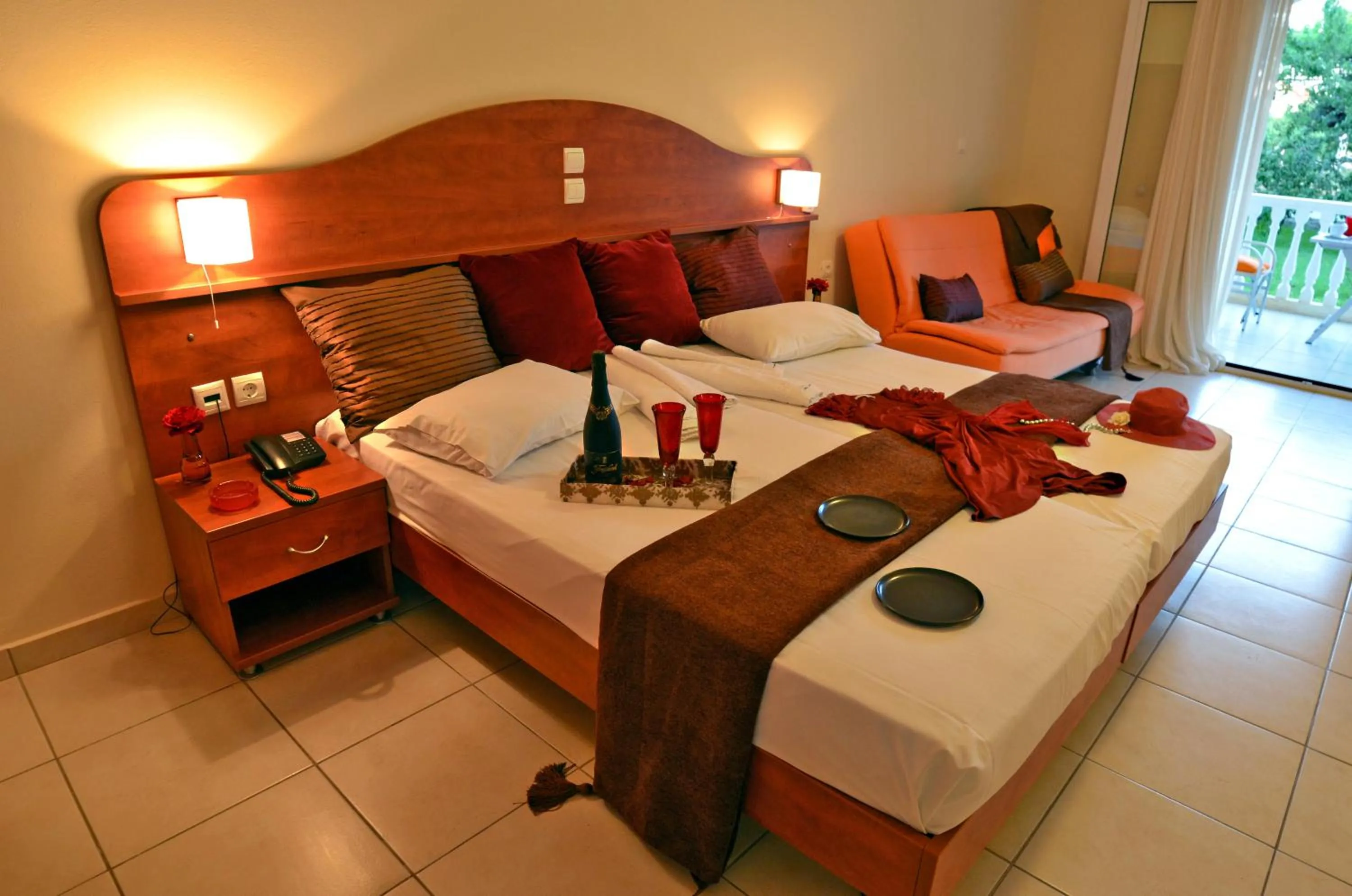 Bed in Belussi Beach Hotel & Suites