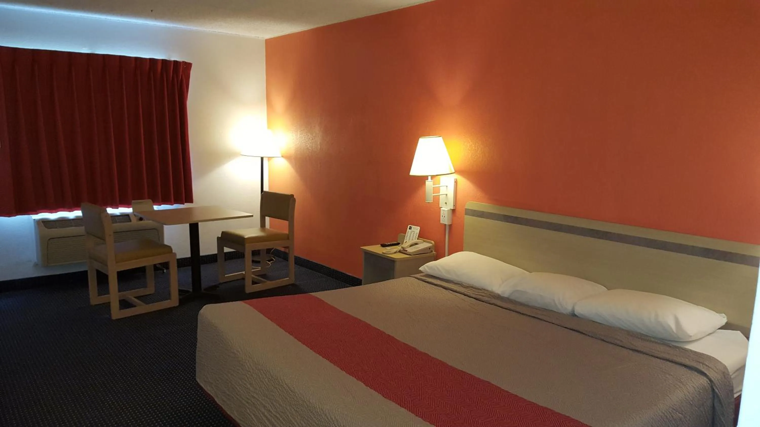 Bed in Red Carpet Inn