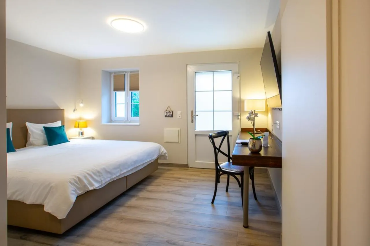 Bed in Auberge des Grands Bois