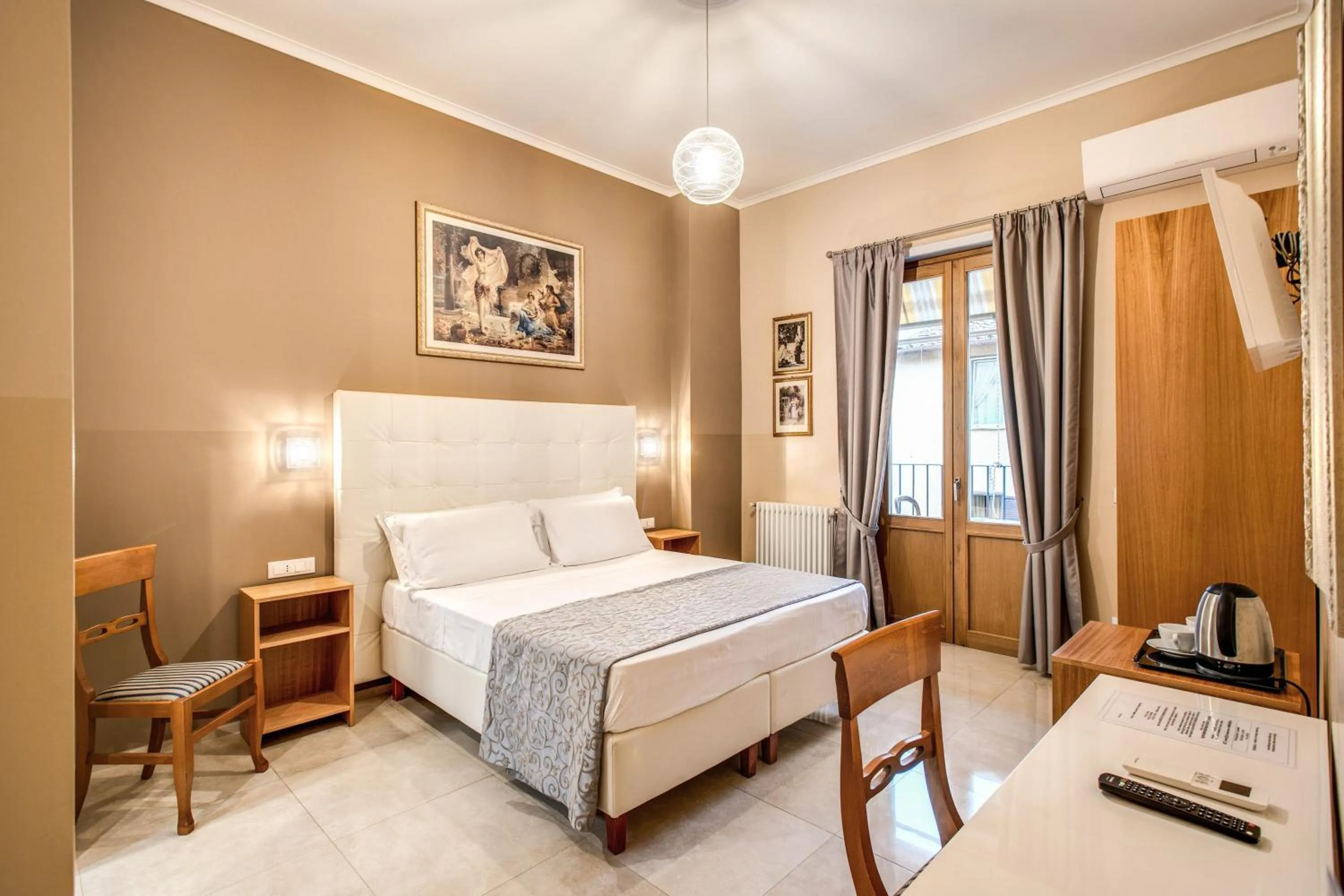 Bed in La Residenza Suites