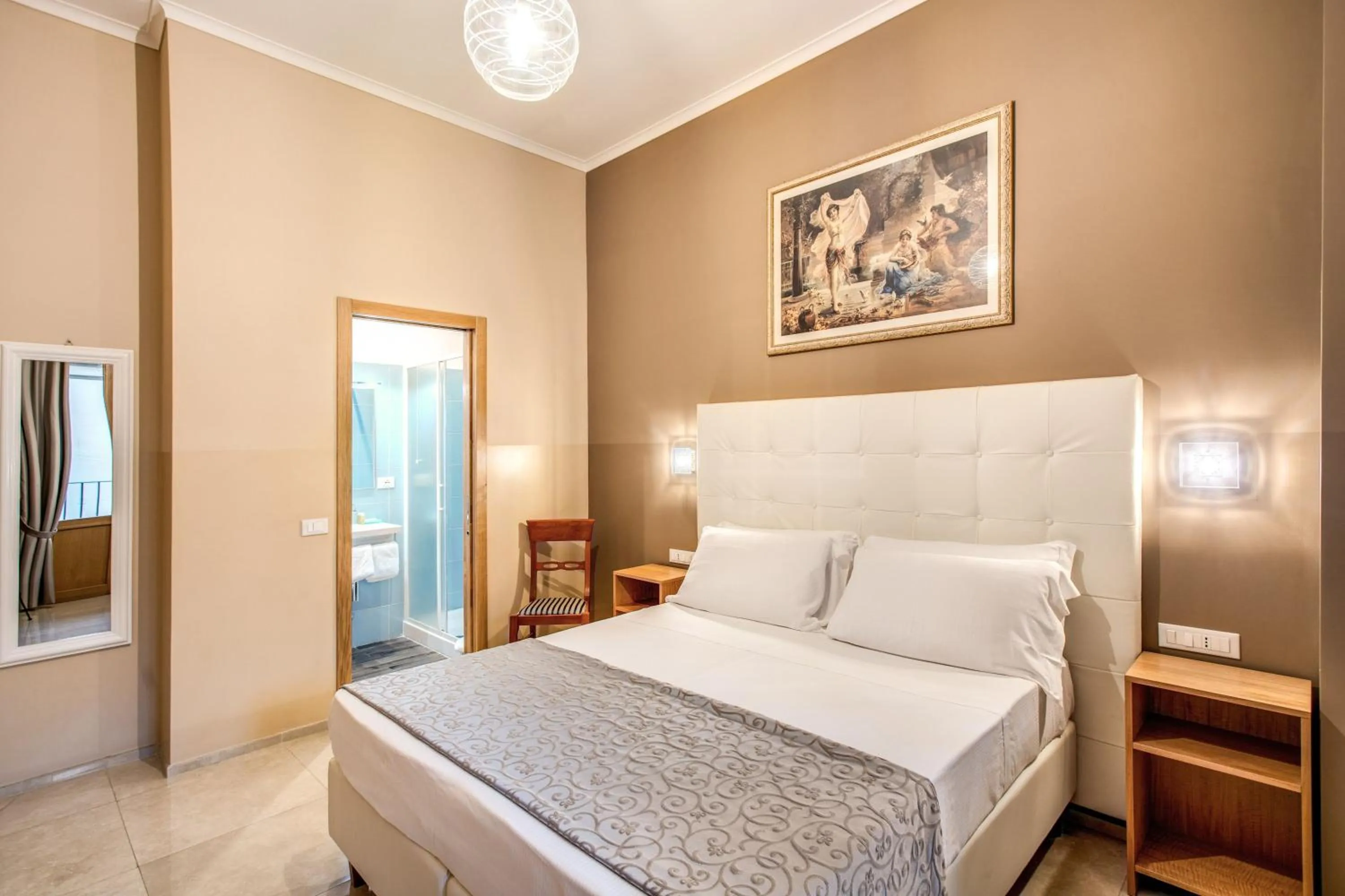 Bed in La Residenza Suites