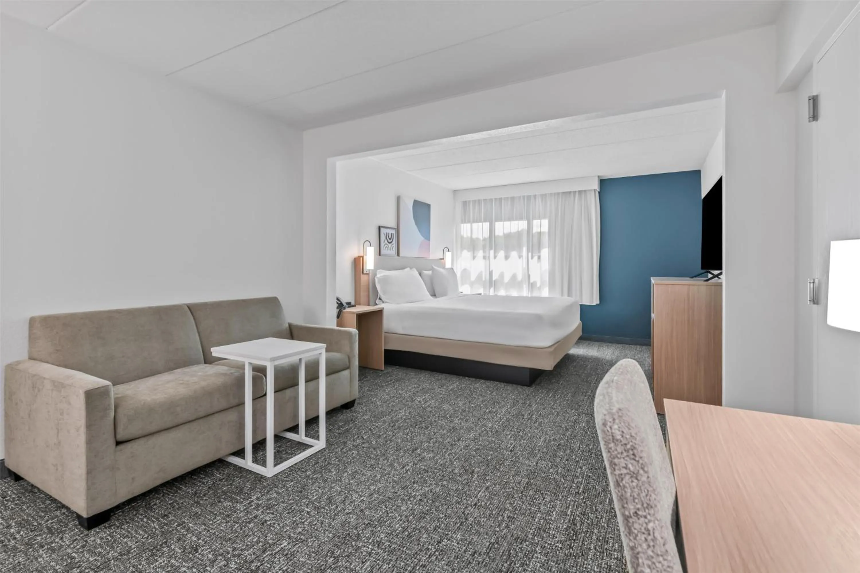 Living room, Bed in Spark by Hilton Mechanicsburg