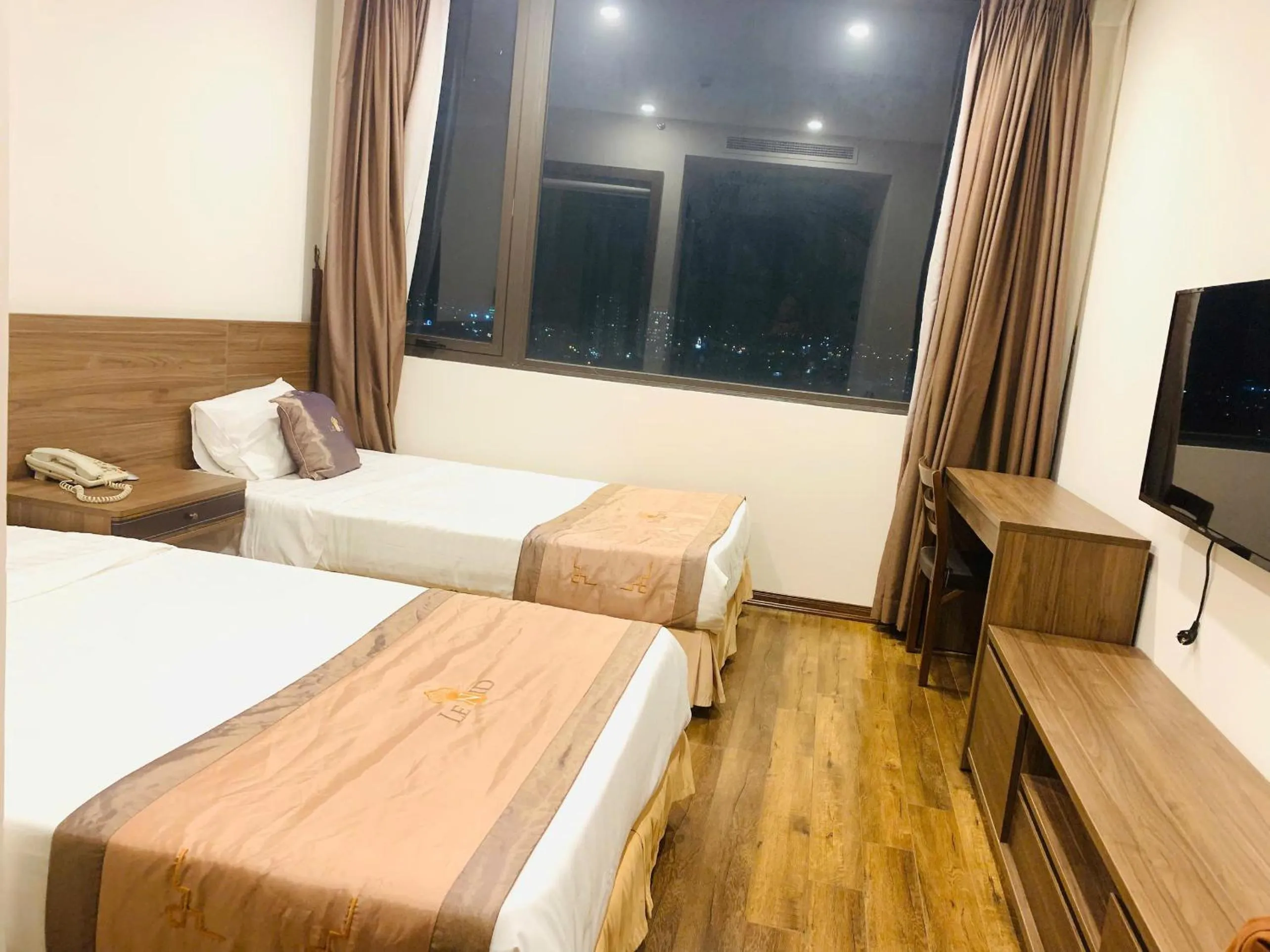 Communal lounge/ TV room, Bed in Lenid Ocean View Hotel