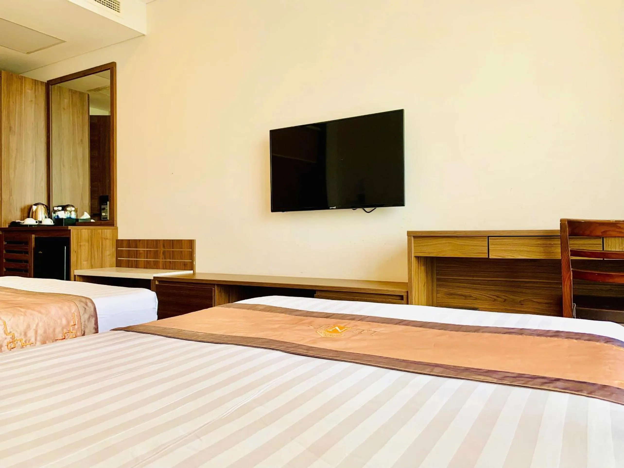 Communal lounge/ TV room, Bed in Lenid Ocean View Hotel