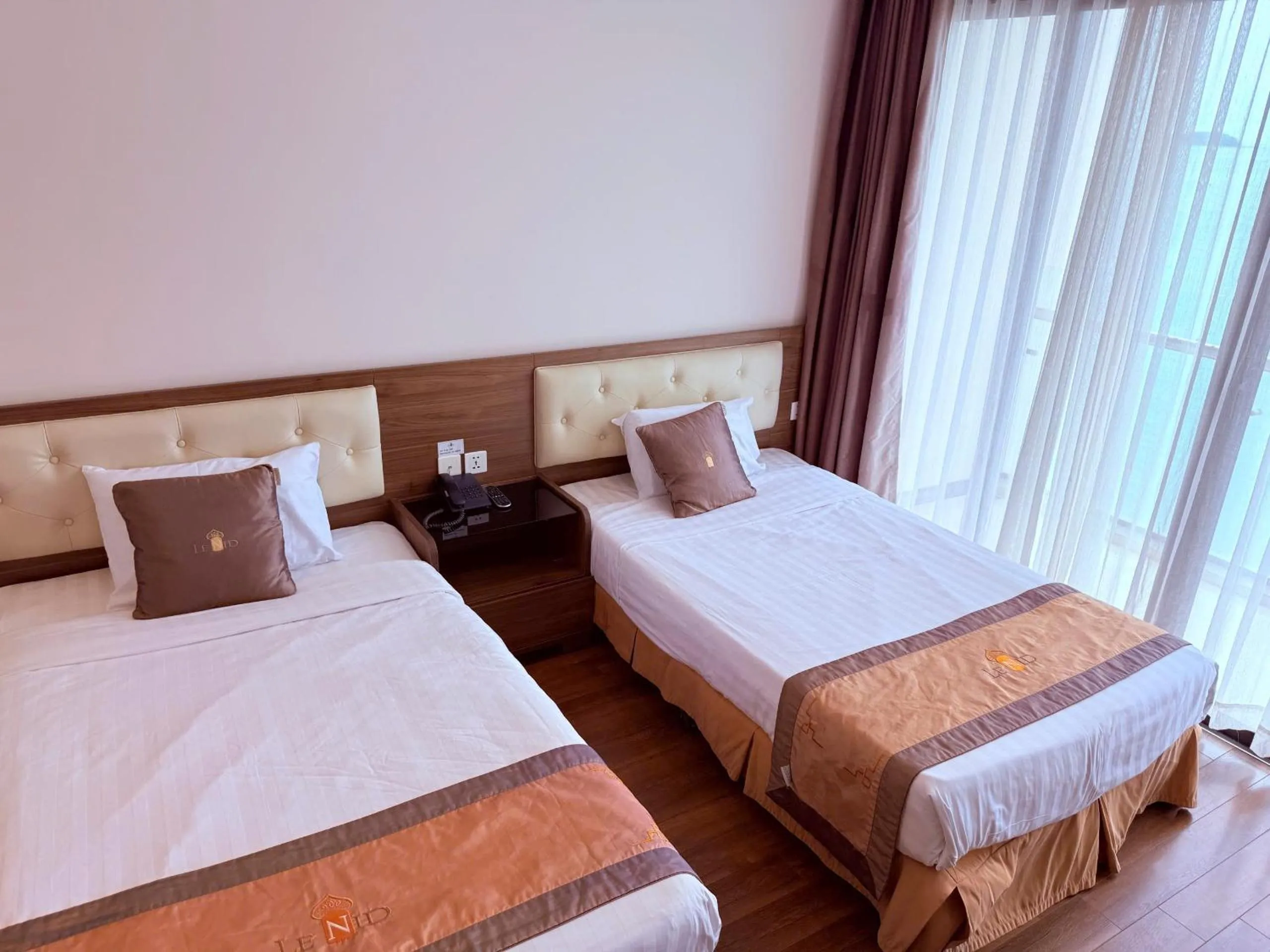 Bed in Lenid Ocean View Hotel