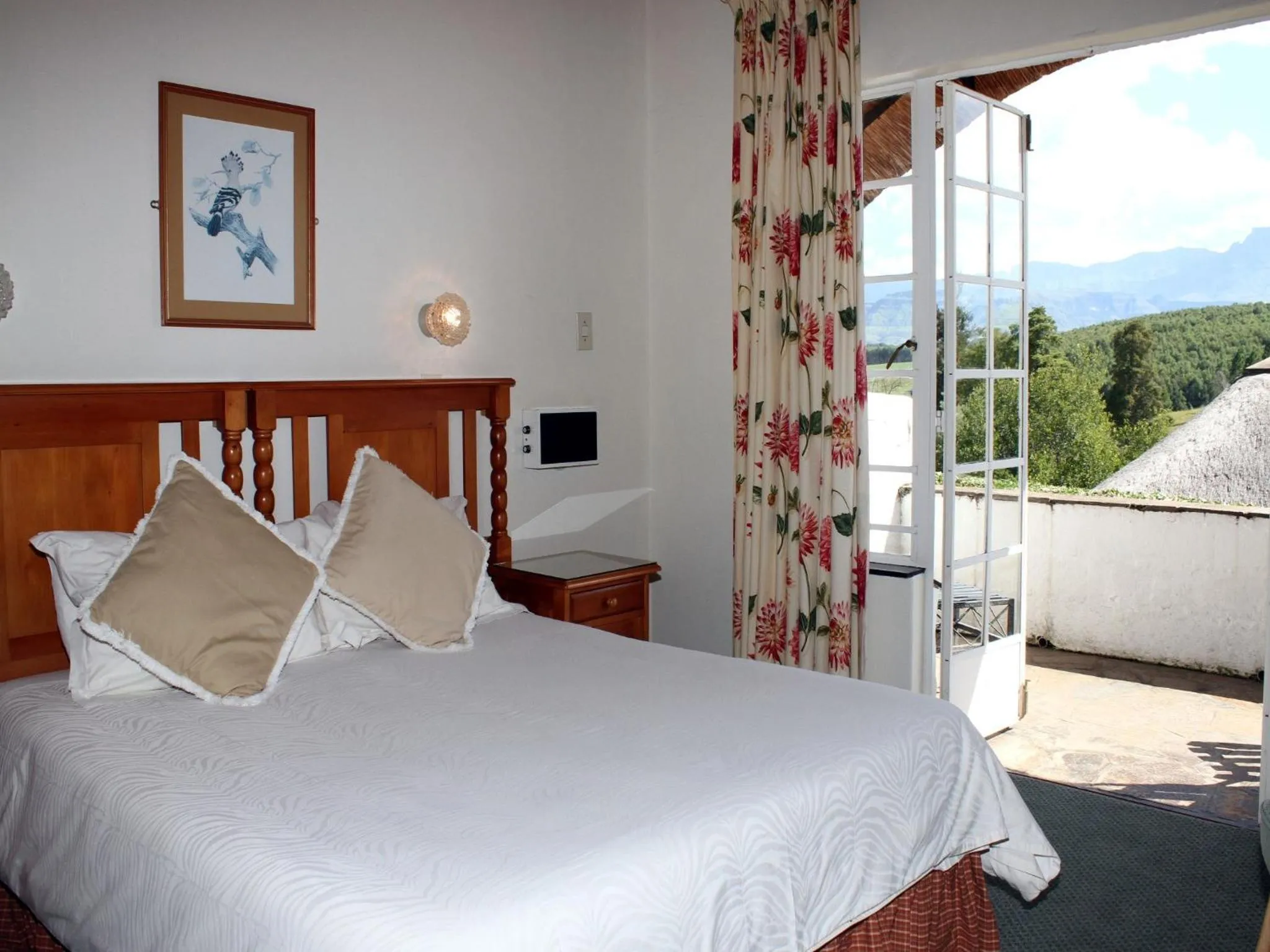 Photo of the whole room, Bed in The Nest Drakensberg Mountain Resort Hotel