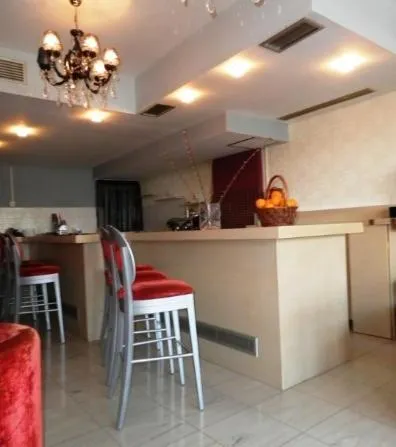 Communal lounge/ TV room in Arcadia Suites & Spa