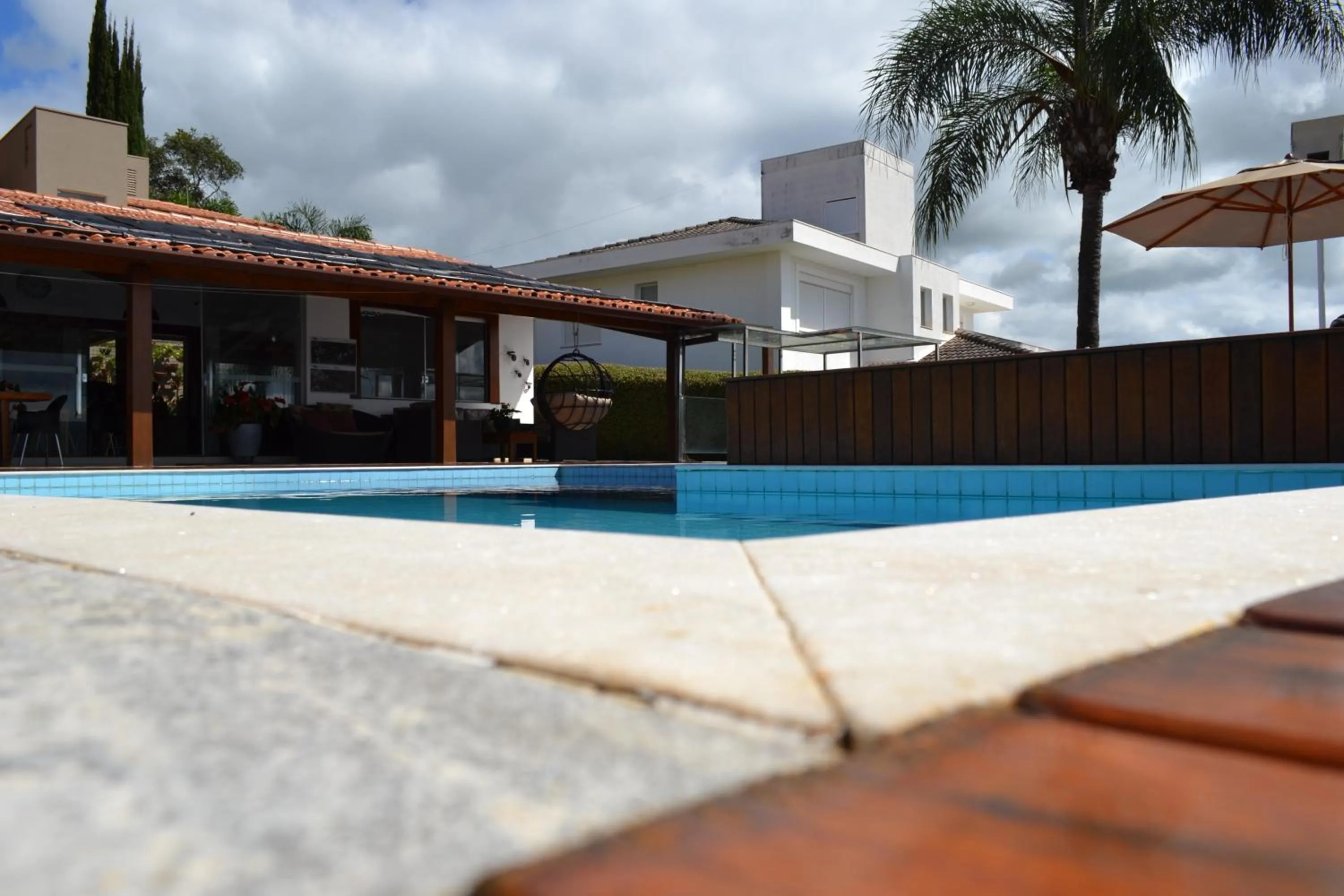 Swimming pool in Pousada Suítes do Lago