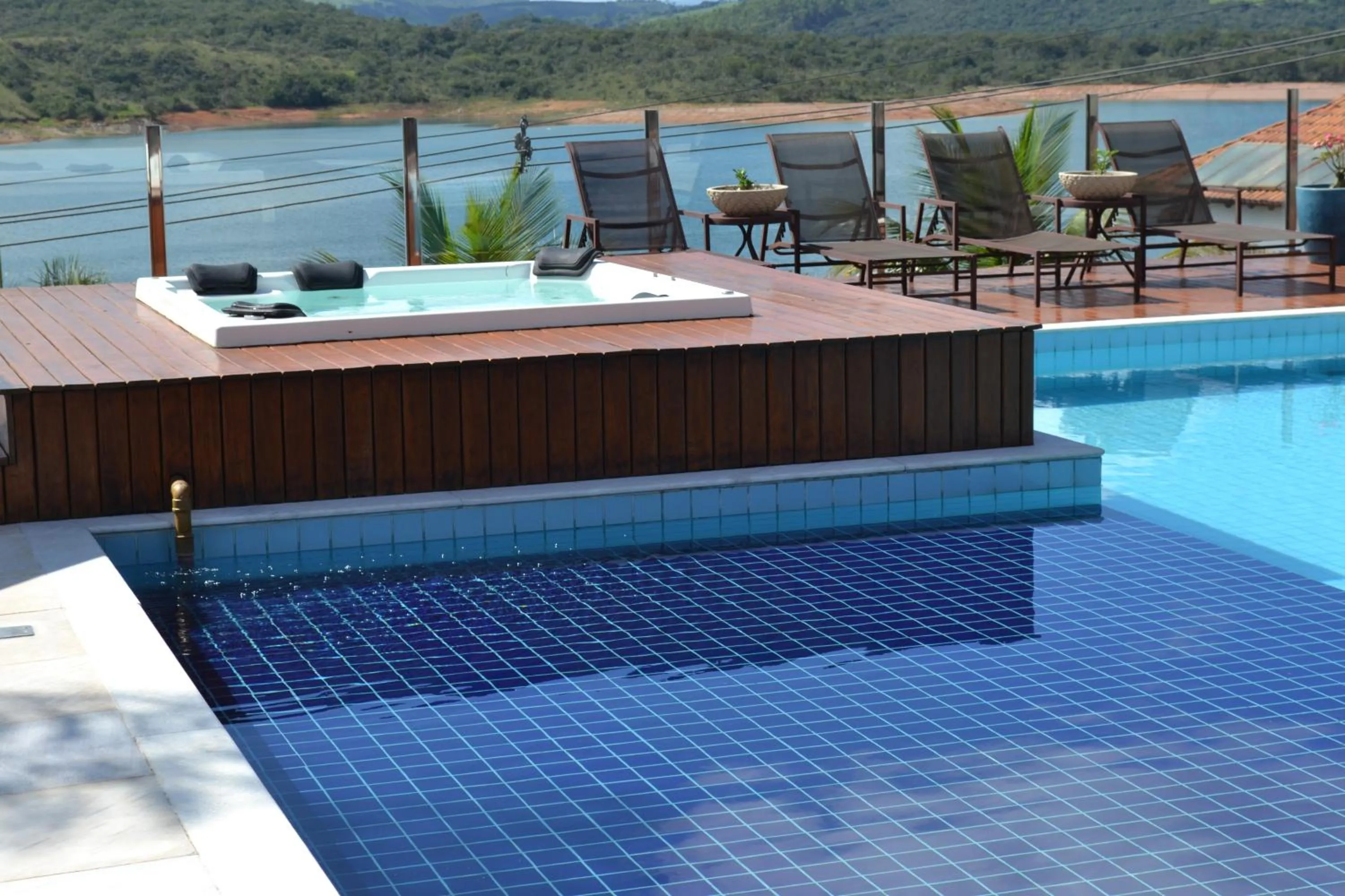 Swimming pool in Pousada Suítes do Lago