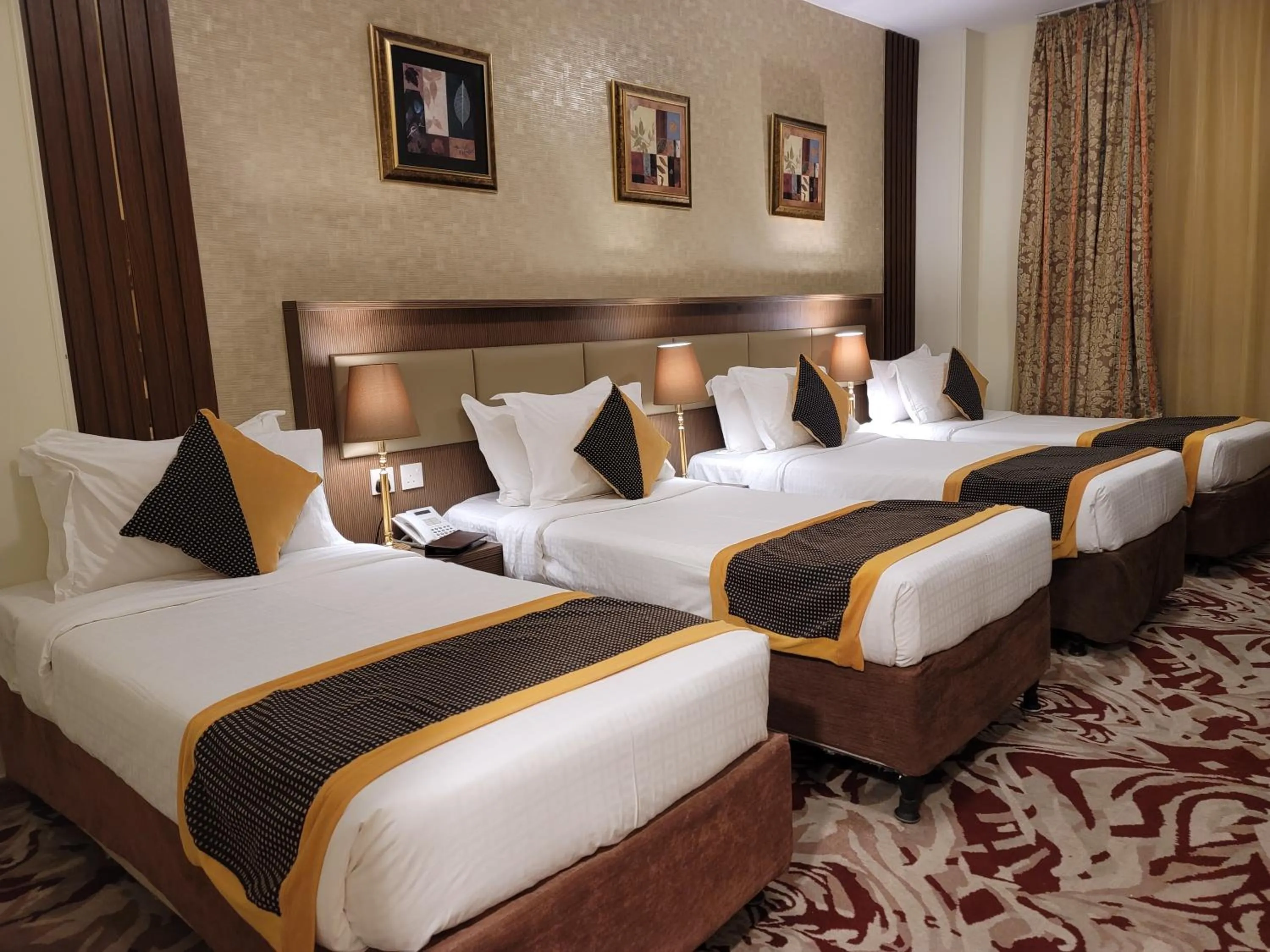 Bed in Al Ansar Palace Golden Tulip Hotel