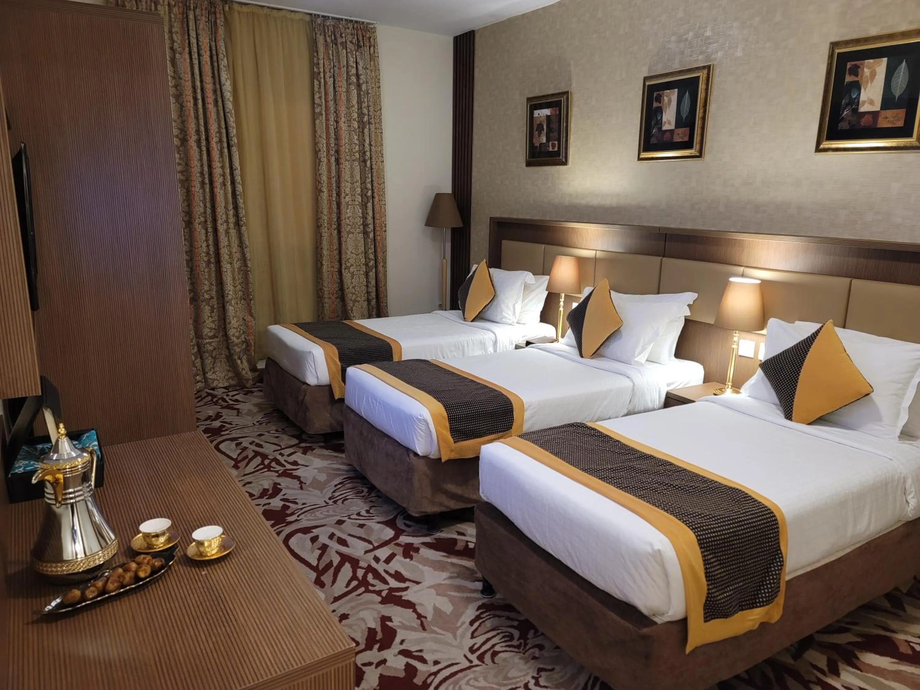Bed in Al Ansar Palace Golden Tulip Hotel
