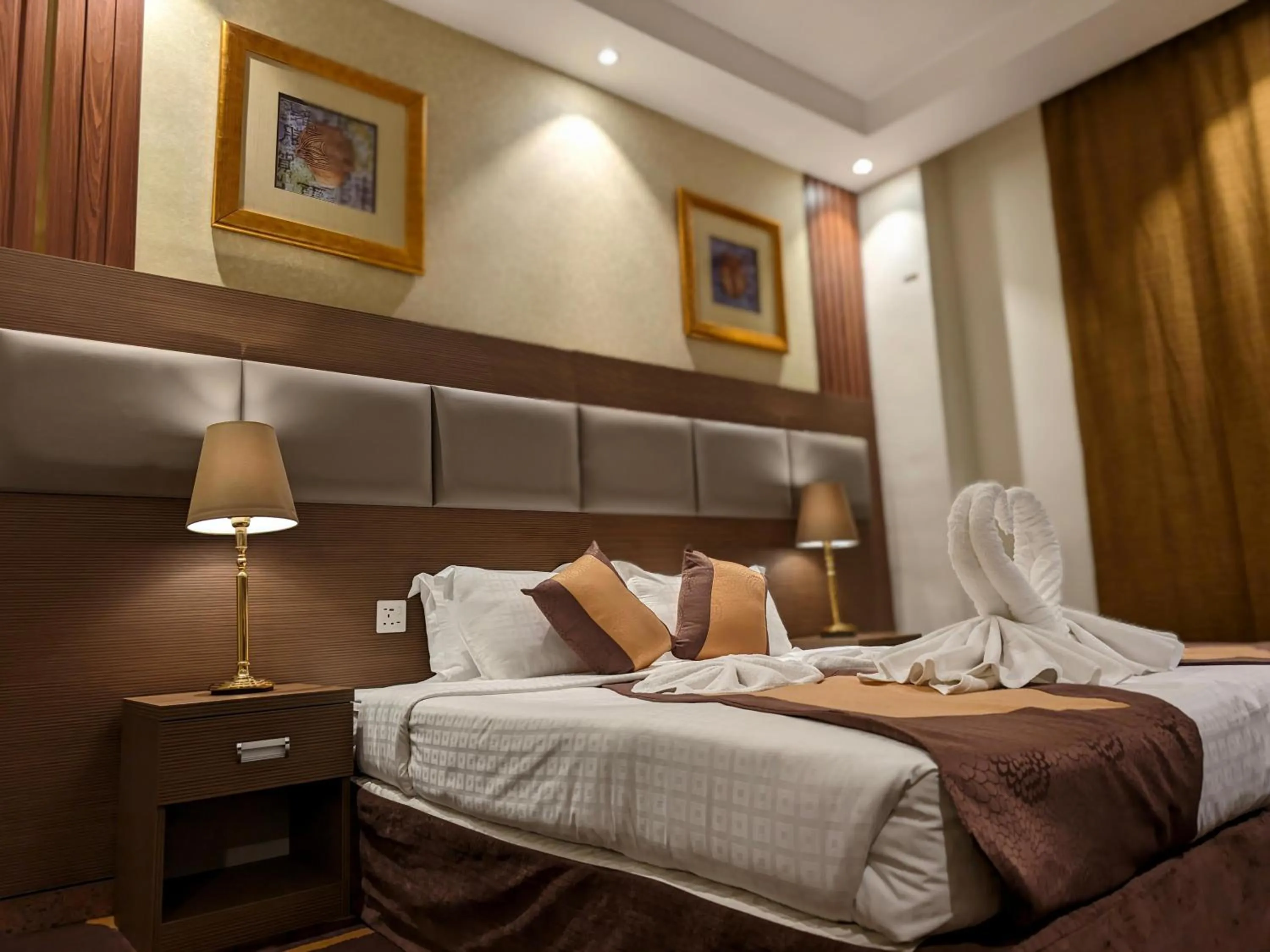 Bed in Al Ansar Palace Golden Tulip Hotel