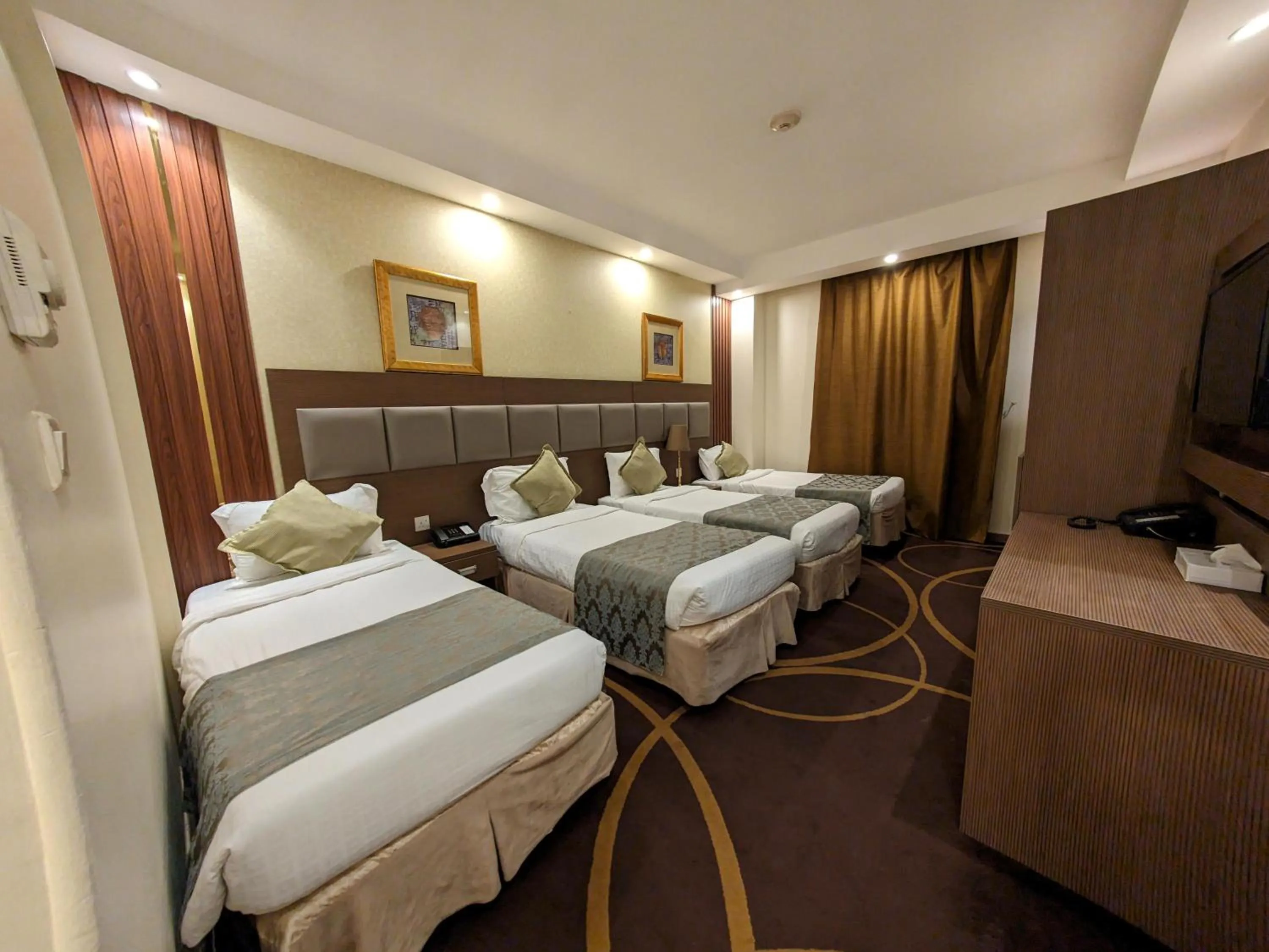 Bed in Al Ansar Palace Golden Tulip Hotel