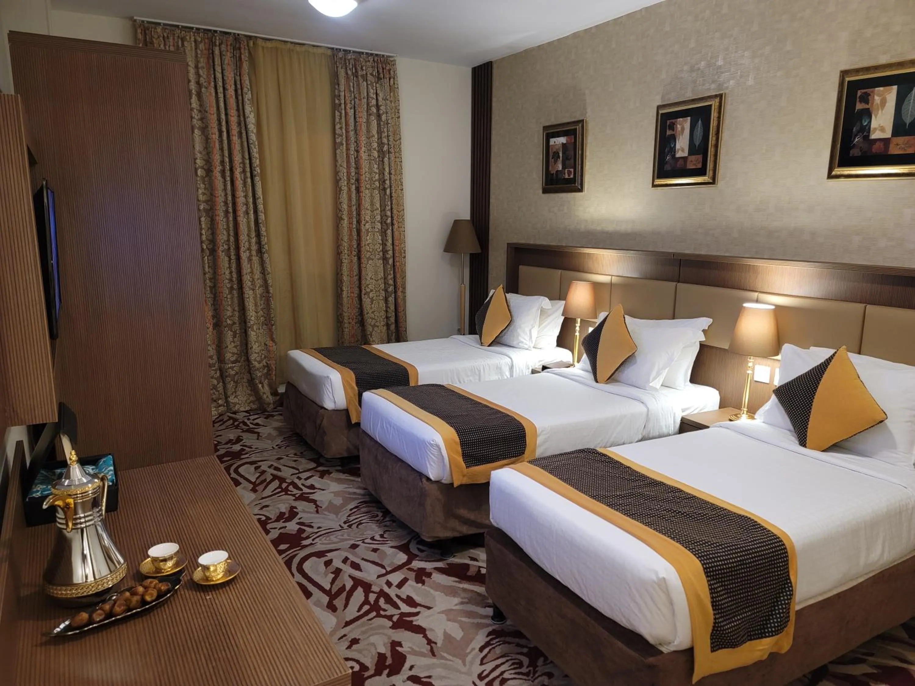 Bed in Al Ansar Palace Golden Tulip Hotel