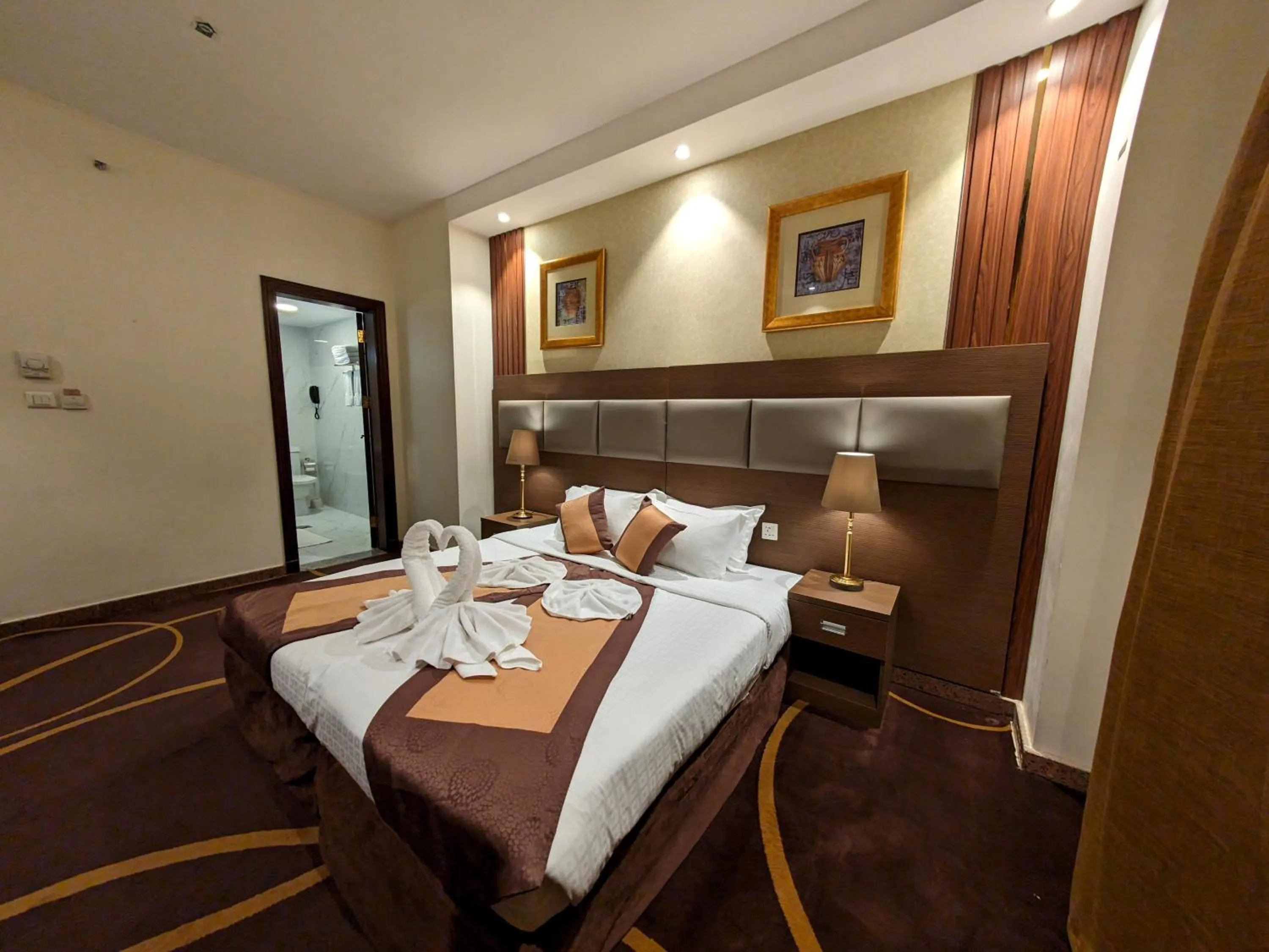 Bed in Al Ansar Palace Golden Tulip Hotel