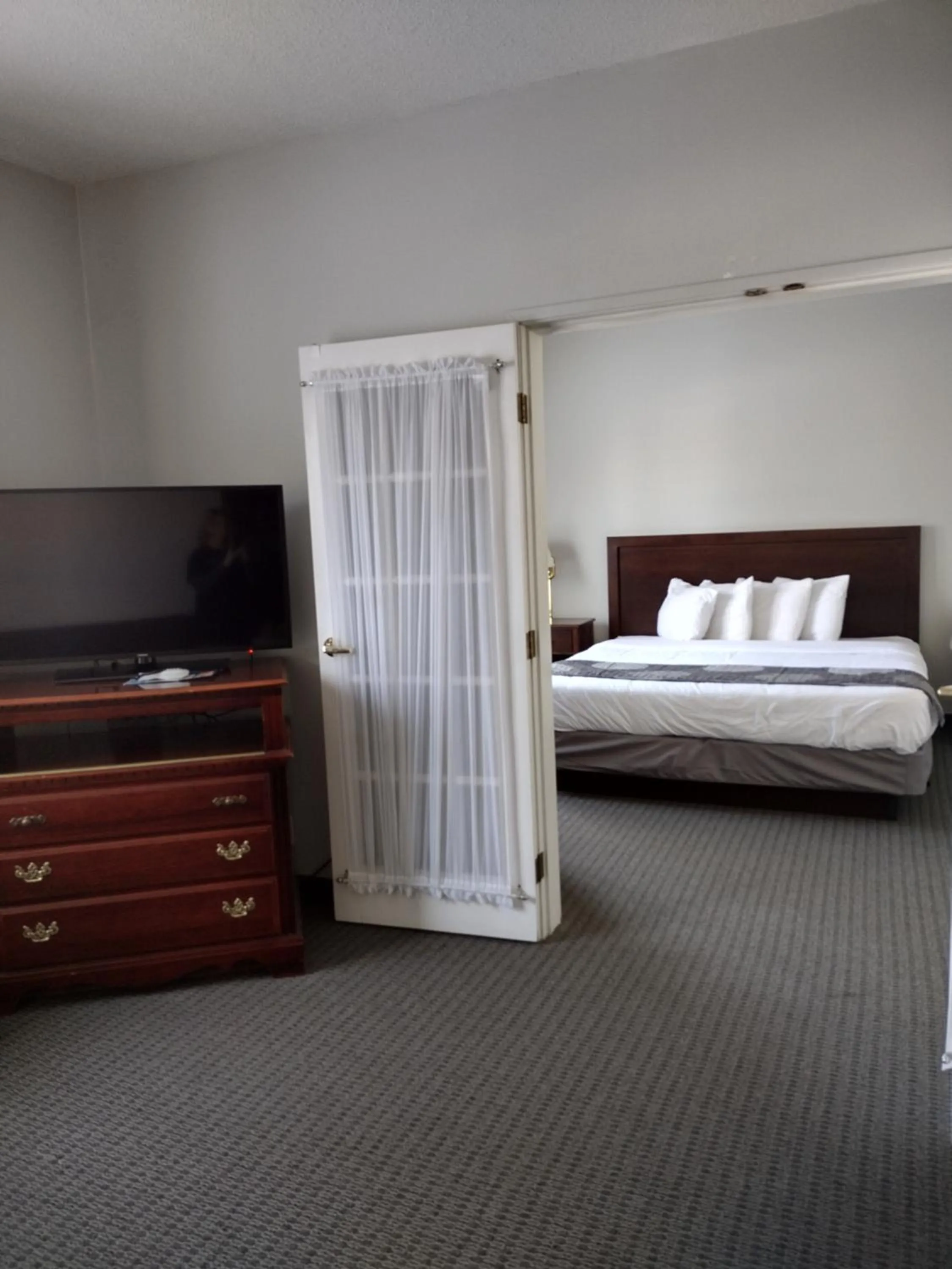Bed in GrandStay Hotel & Suites Hastings