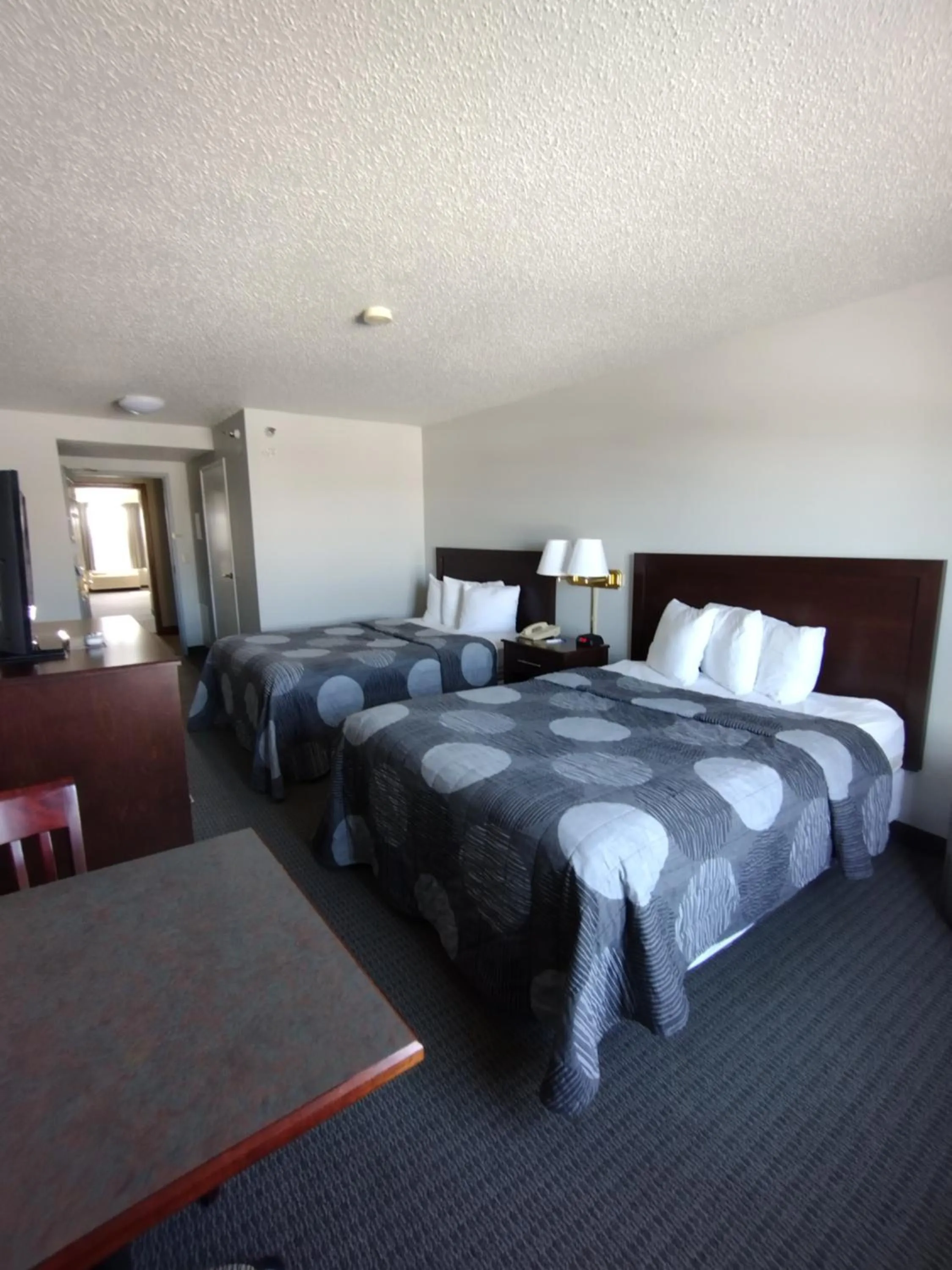 Bed in GrandStay Hotel & Suites Hastings