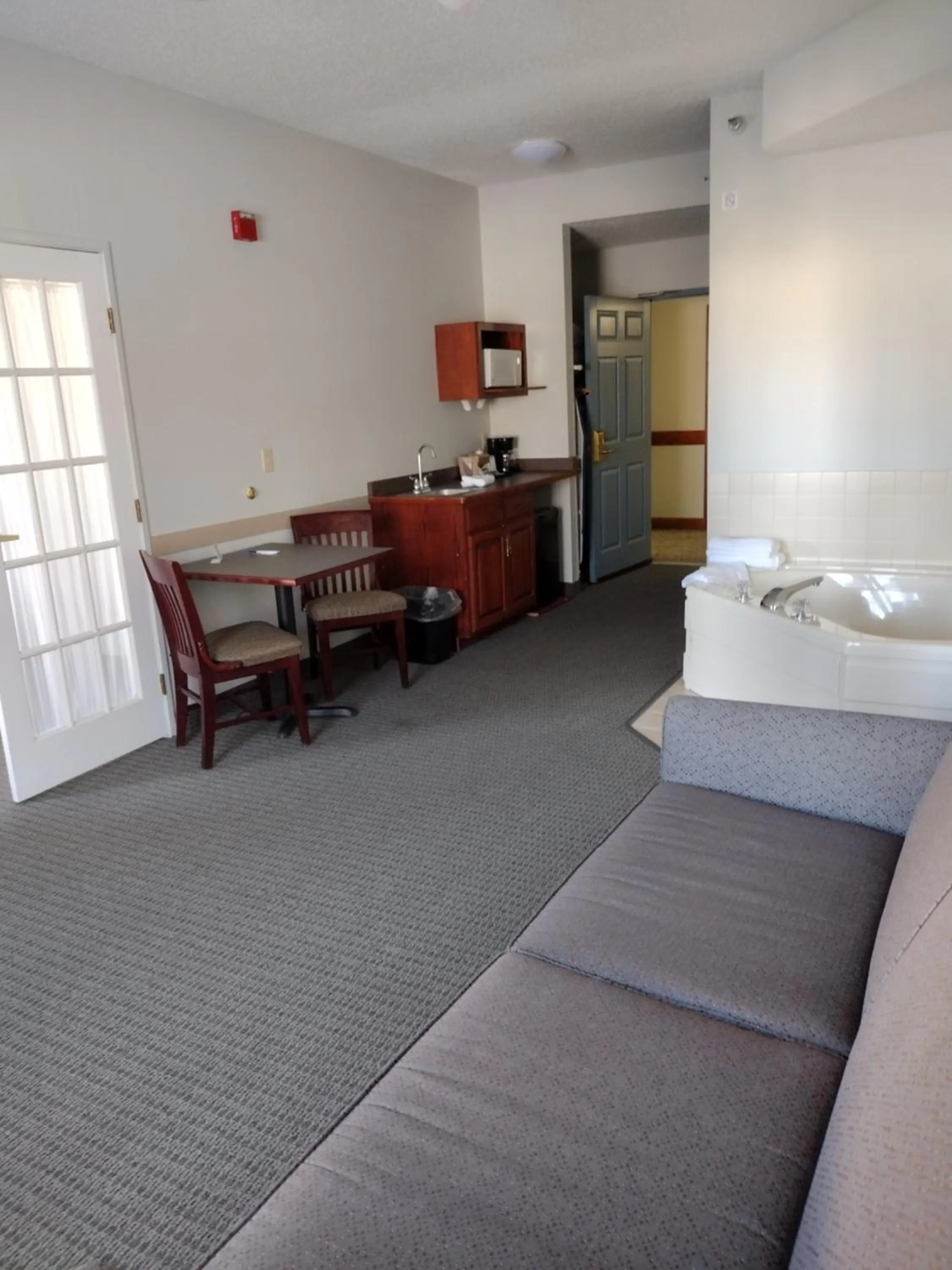 Bed in GrandStay Hotel & Suites Hastings