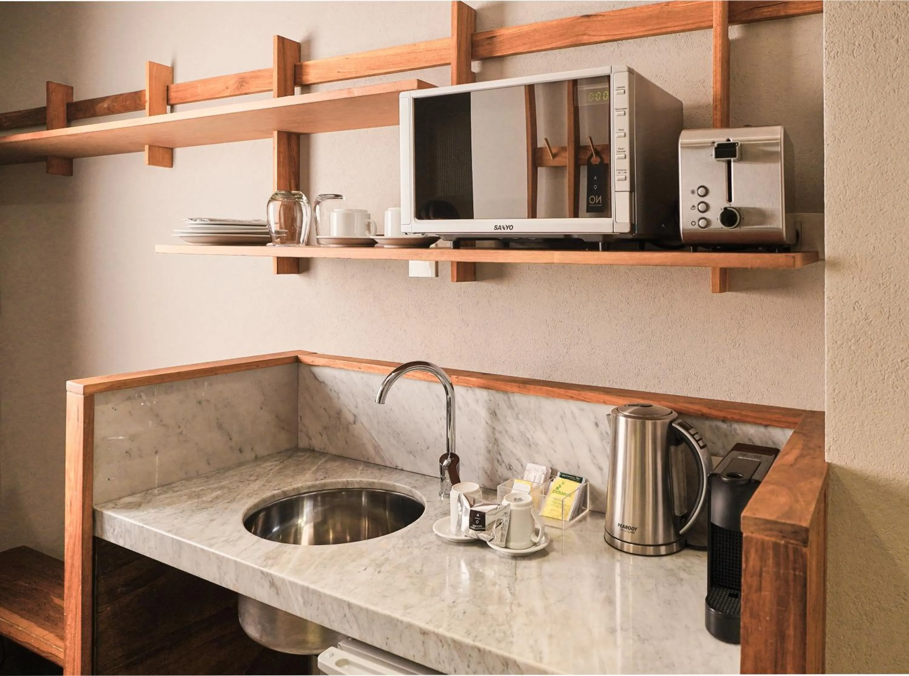 Bedroom in AQ Tailored Suites