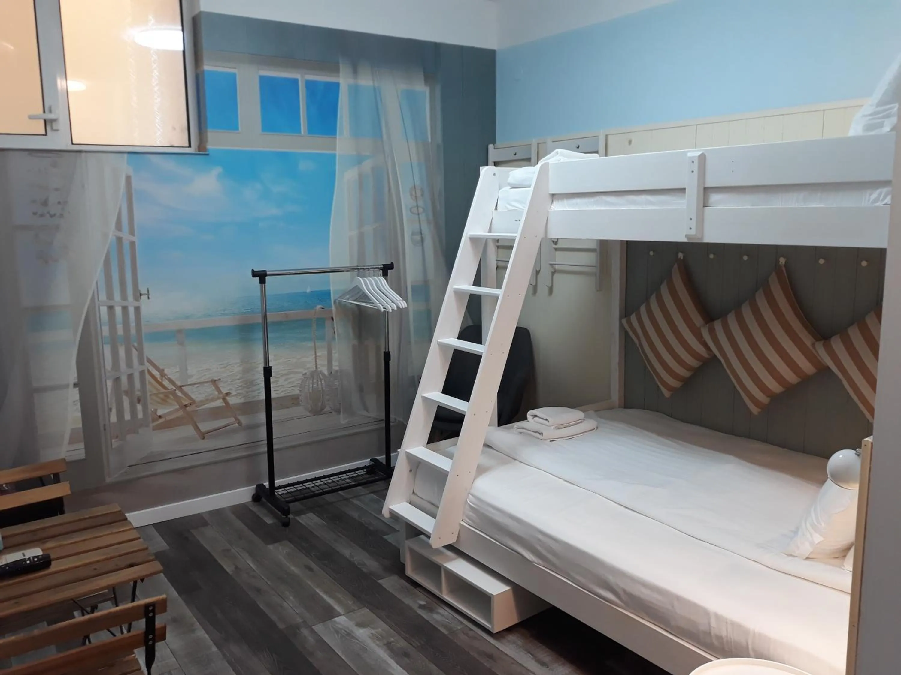 bunk bed, Bed in Three Dolphins Hotel with a Rooftop terracе