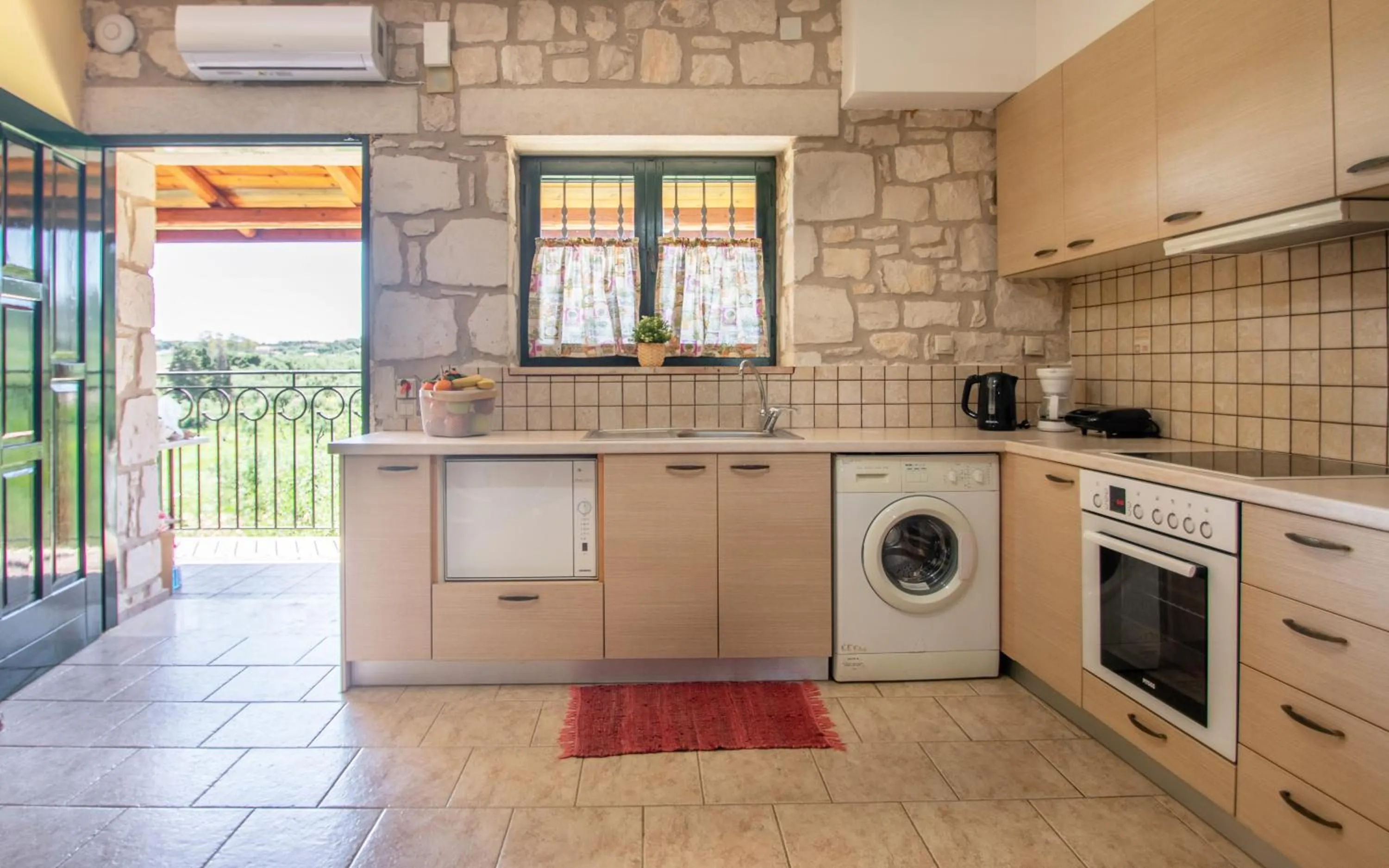 Kitchen or kitchenette in Ammos Zante Villas