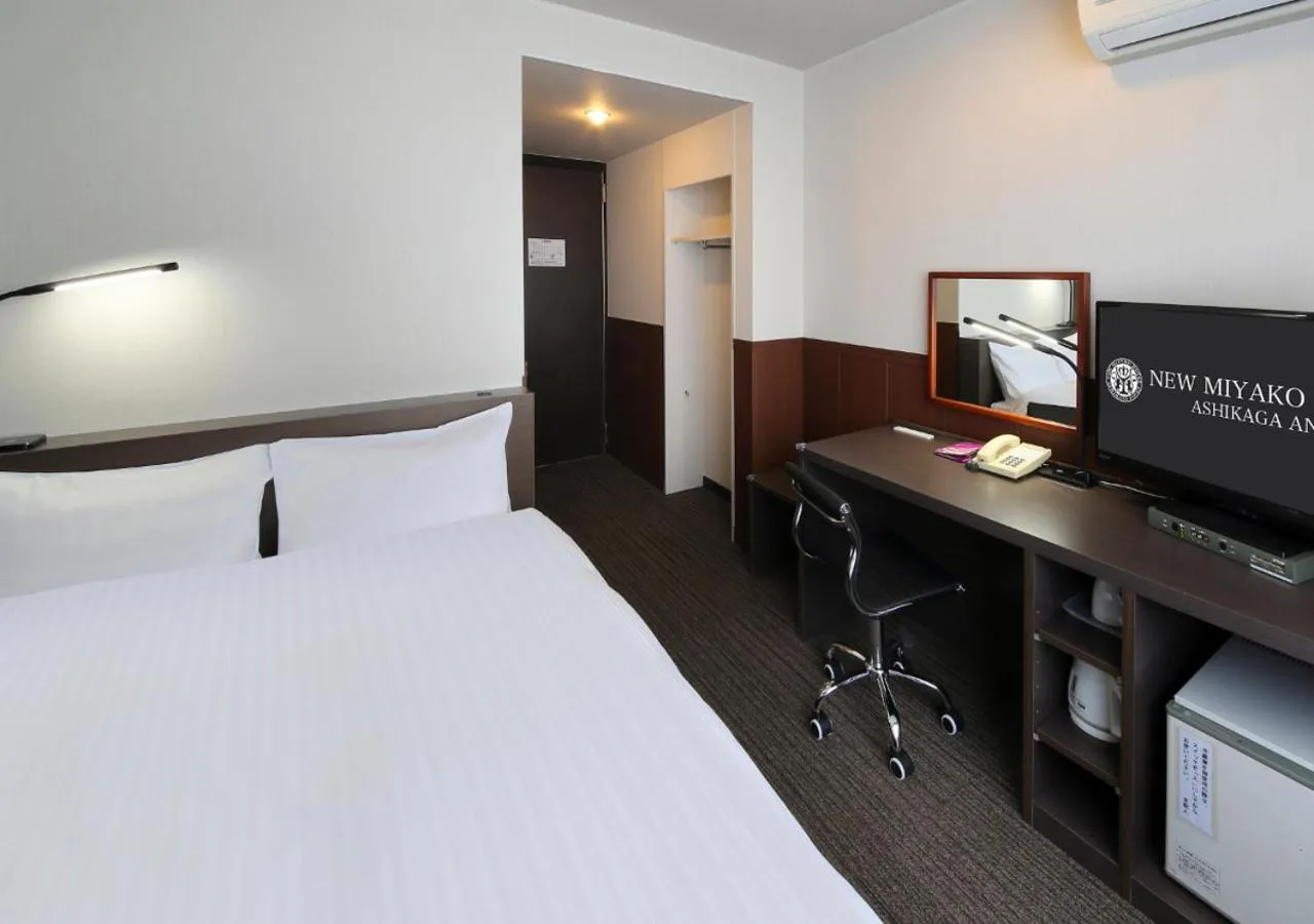 Bed in New Miyako Hotel Ashikaga Annex