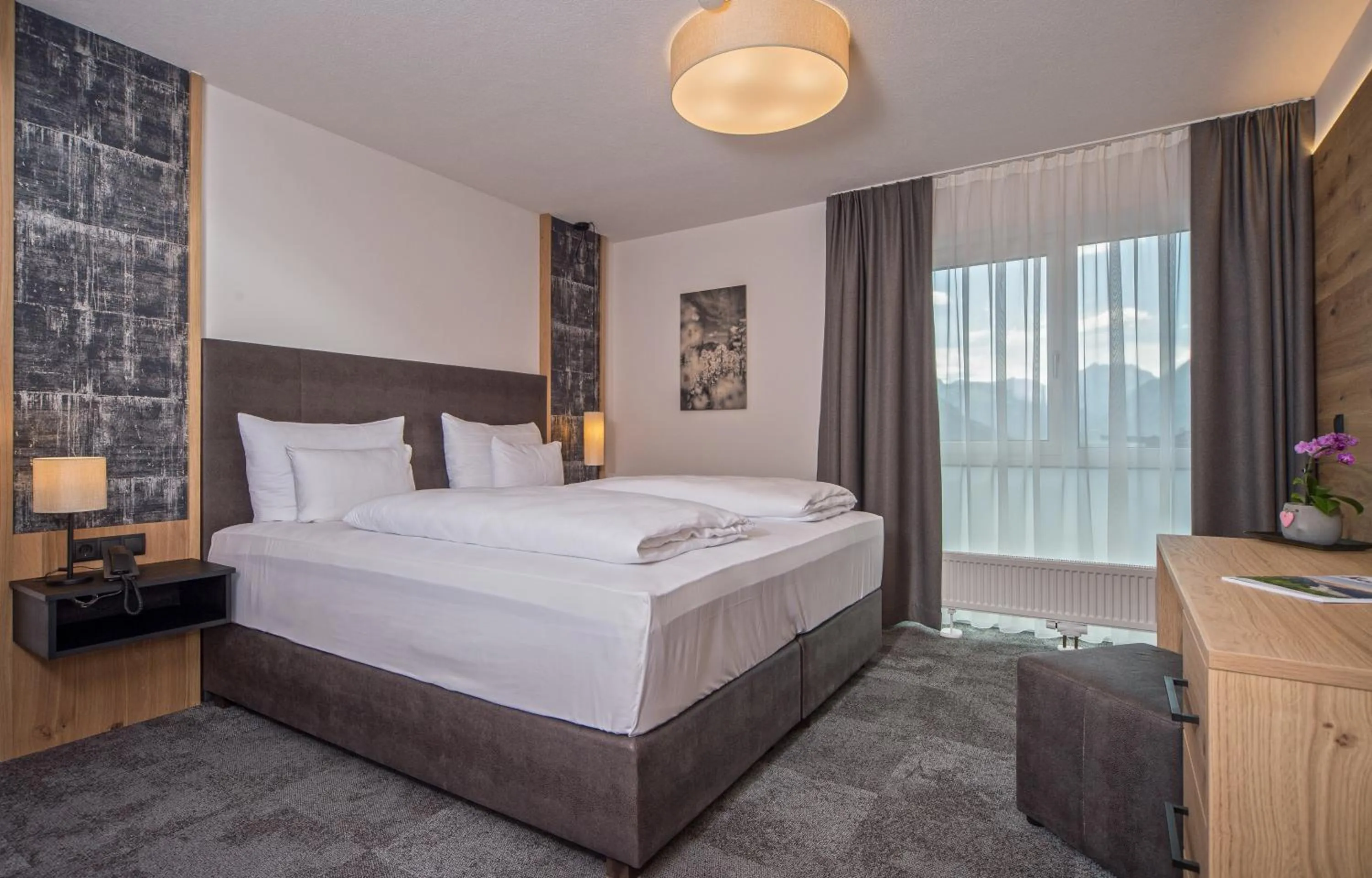 Bed in Arthur's Hotel und Apartments am Achensee