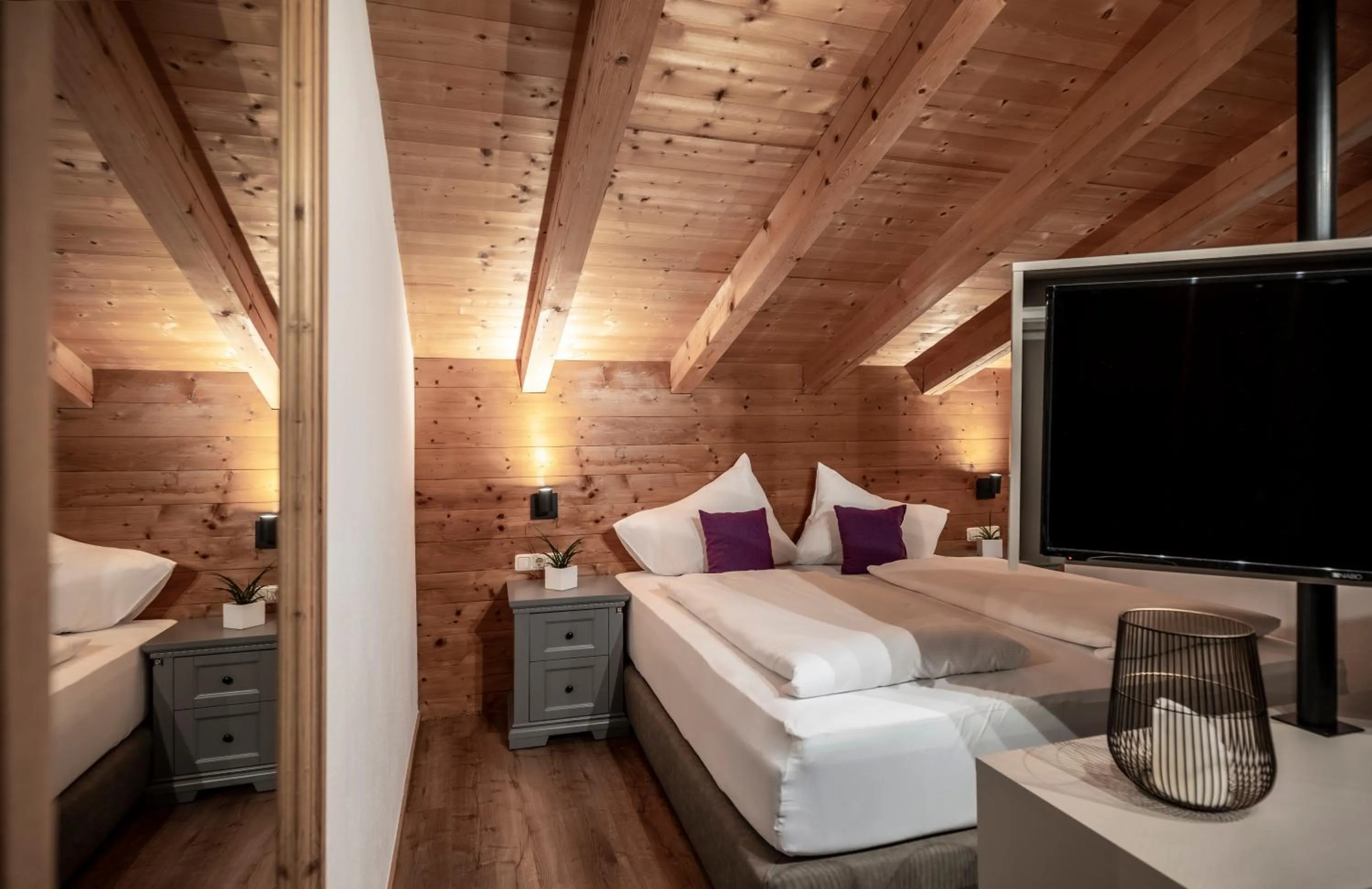 Bed in Arthur's Hotel und Apartments am Achensee