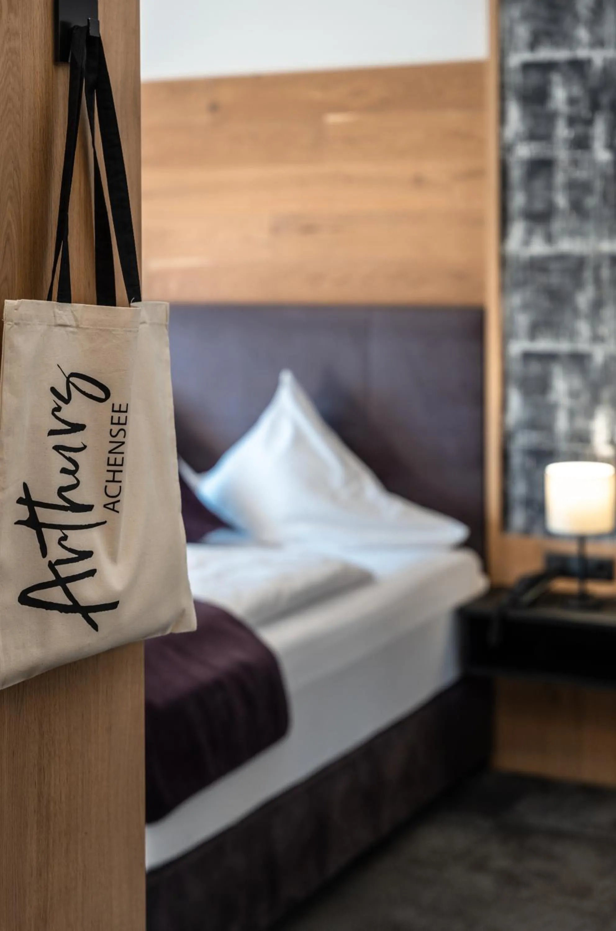 Bed in Arthur's Hotel und Apartments am Achensee