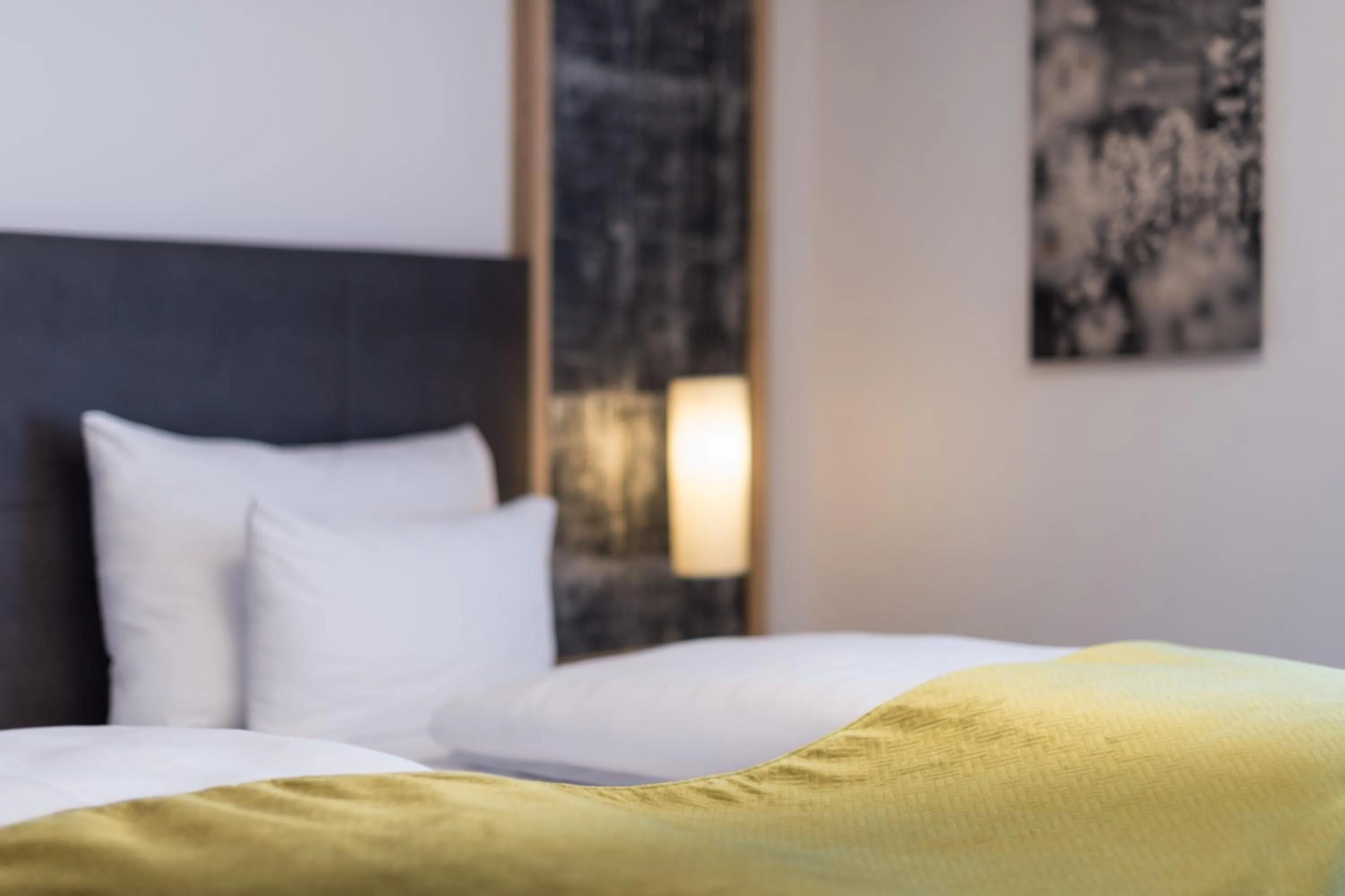 Bed in Arthur's Hotel und Apartments am Achensee