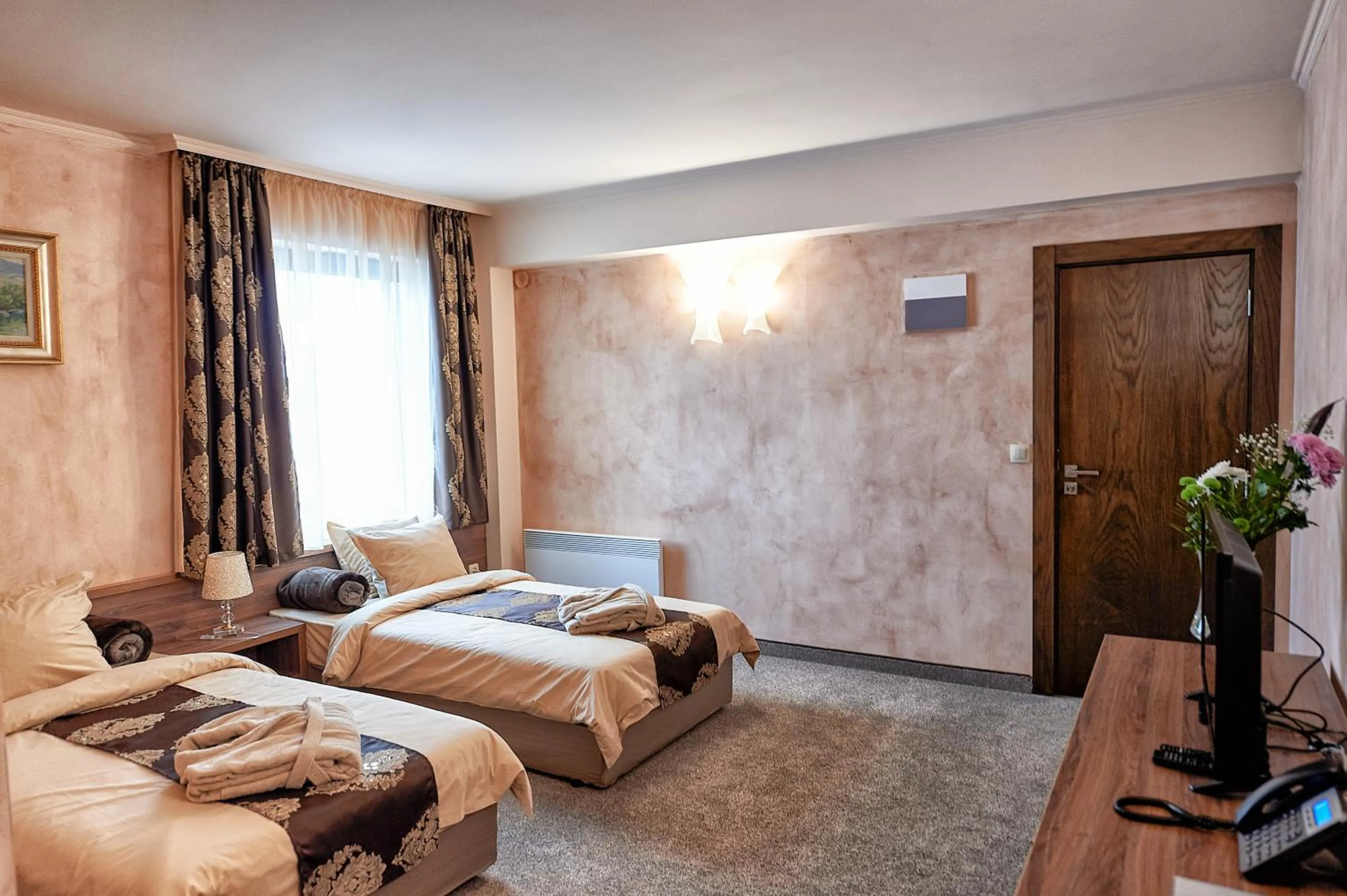 Bed in Platinum Image Hotel