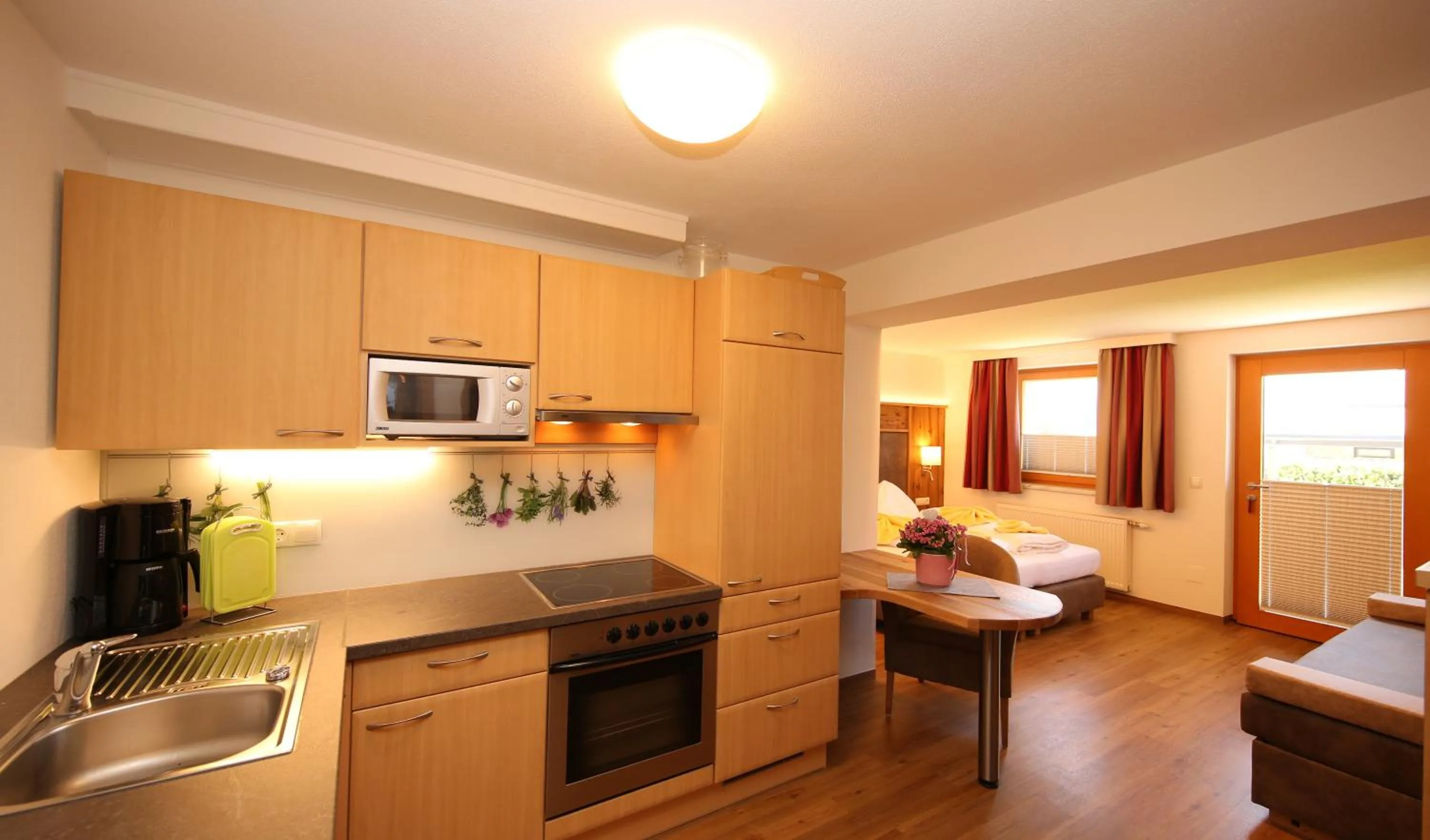 Kitchen or kitchenette in Aparthotel DAS Hochkönig