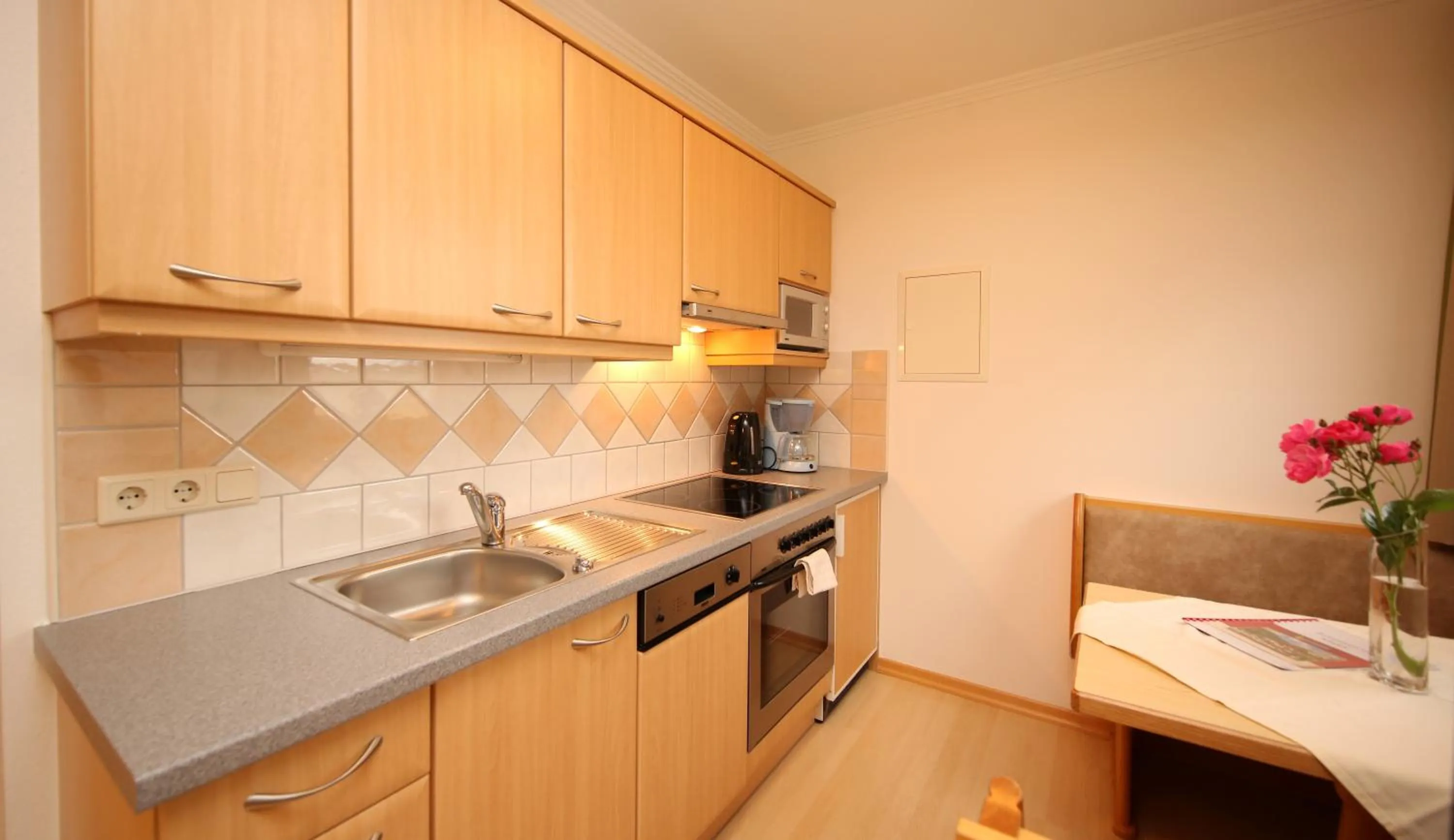 Kitchen or kitchenette in Aparthotel DAS Hochkönig