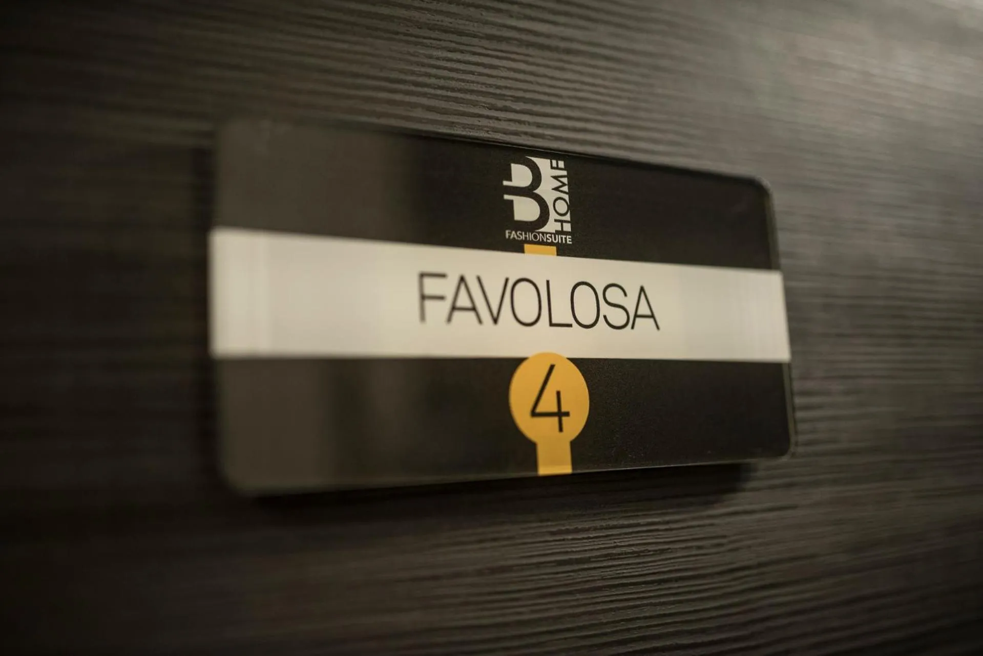 Property logo or sign in BHome Fashion Suite