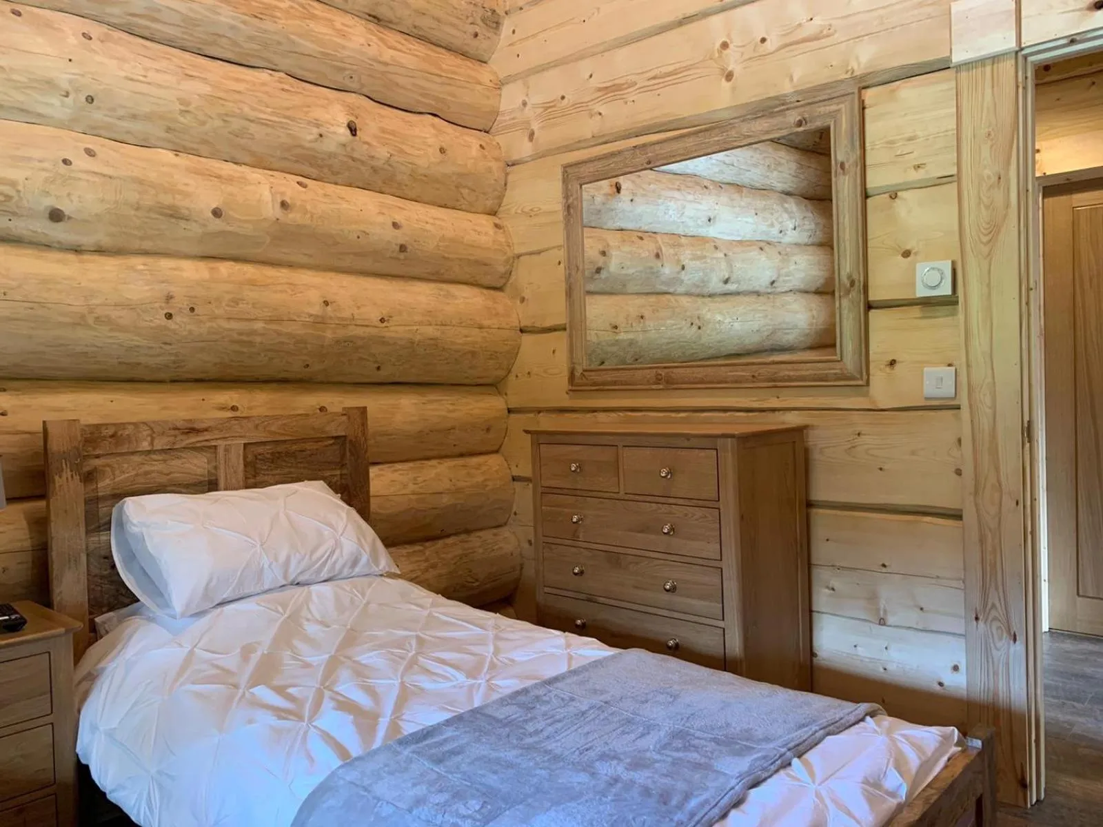Bed in Ewes Water Log Cabins