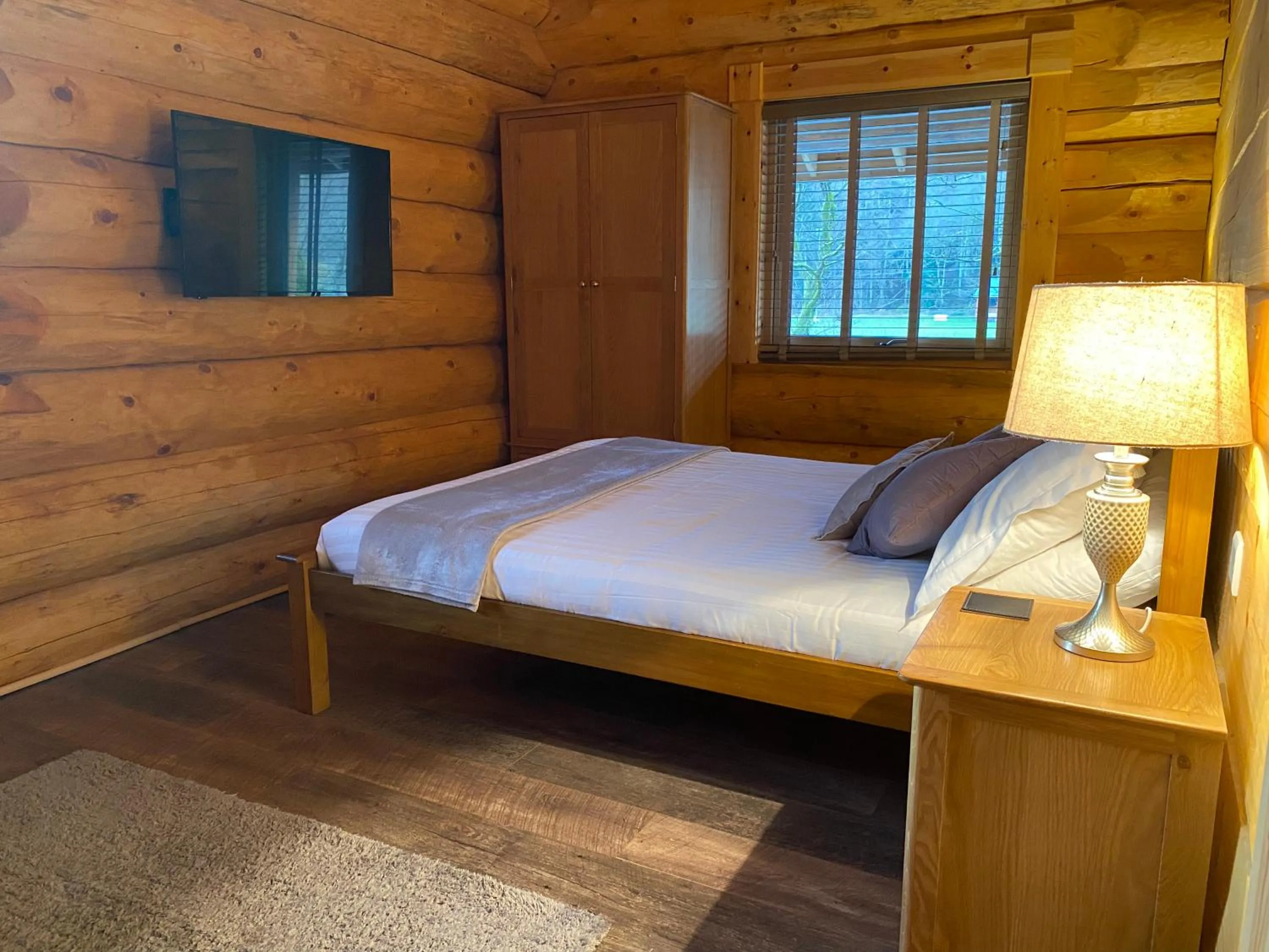 Bed in Ewes Water Log Cabins